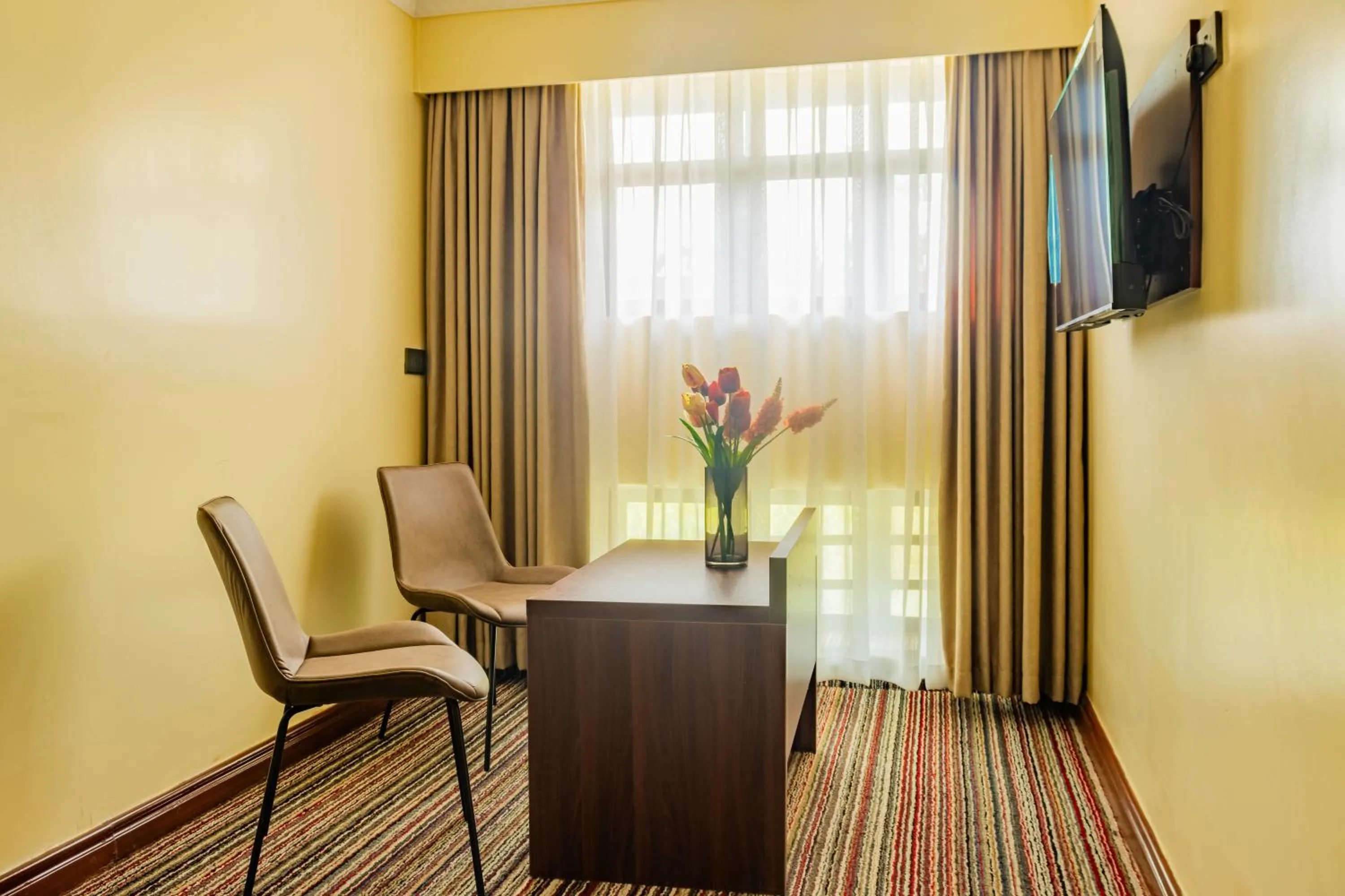 Communal lounge/ TV room in Karen Plains Hotel Nairobi