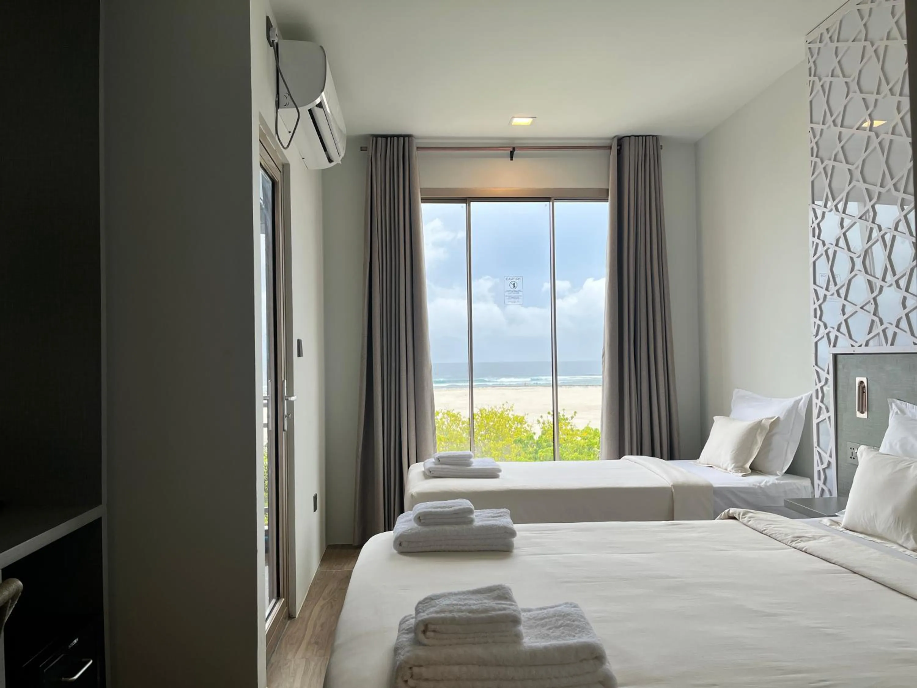 Guests, Bed in Avyanna Gulhi Beach Hotel