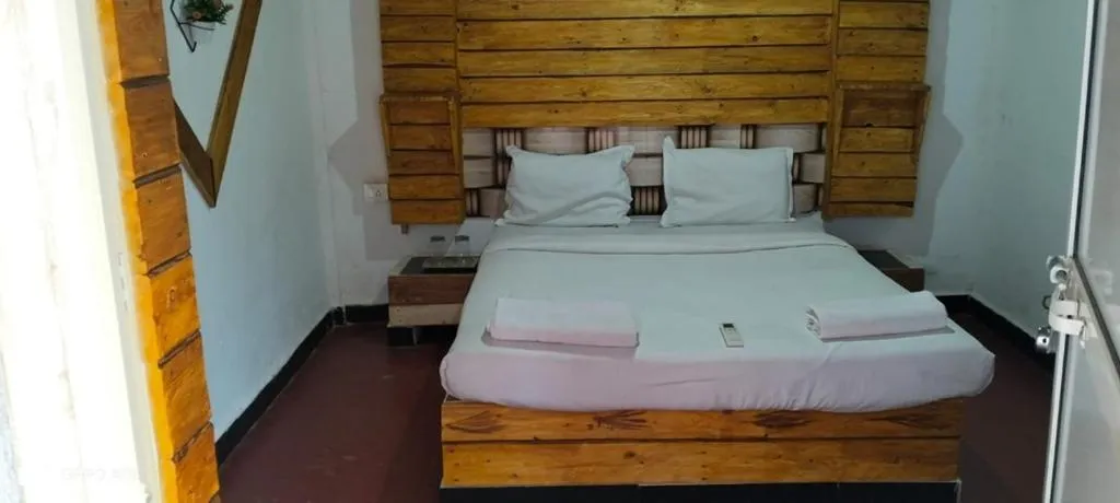 Bed in La Paulo's Back to Basic Beach Resort