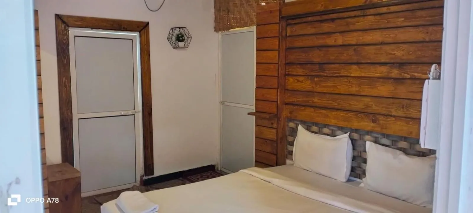 Bed in La Paulo's Back to Basic Beach Resort