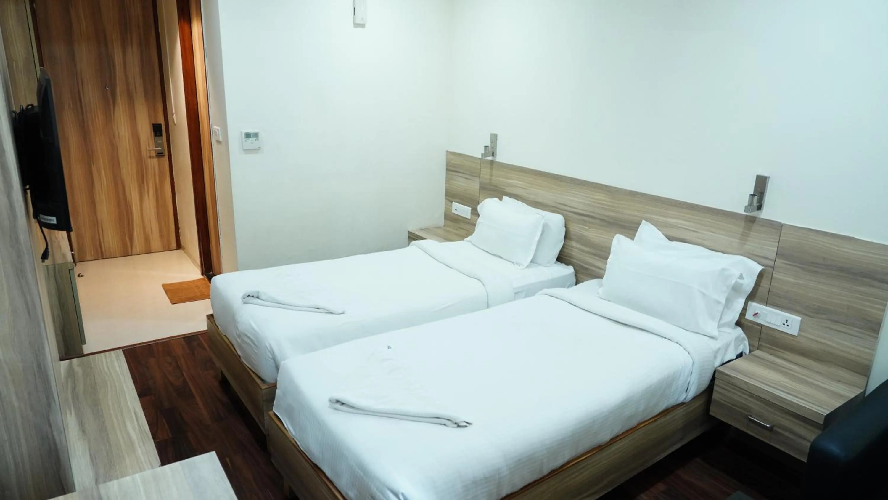 Bed in Hotel RN Grand