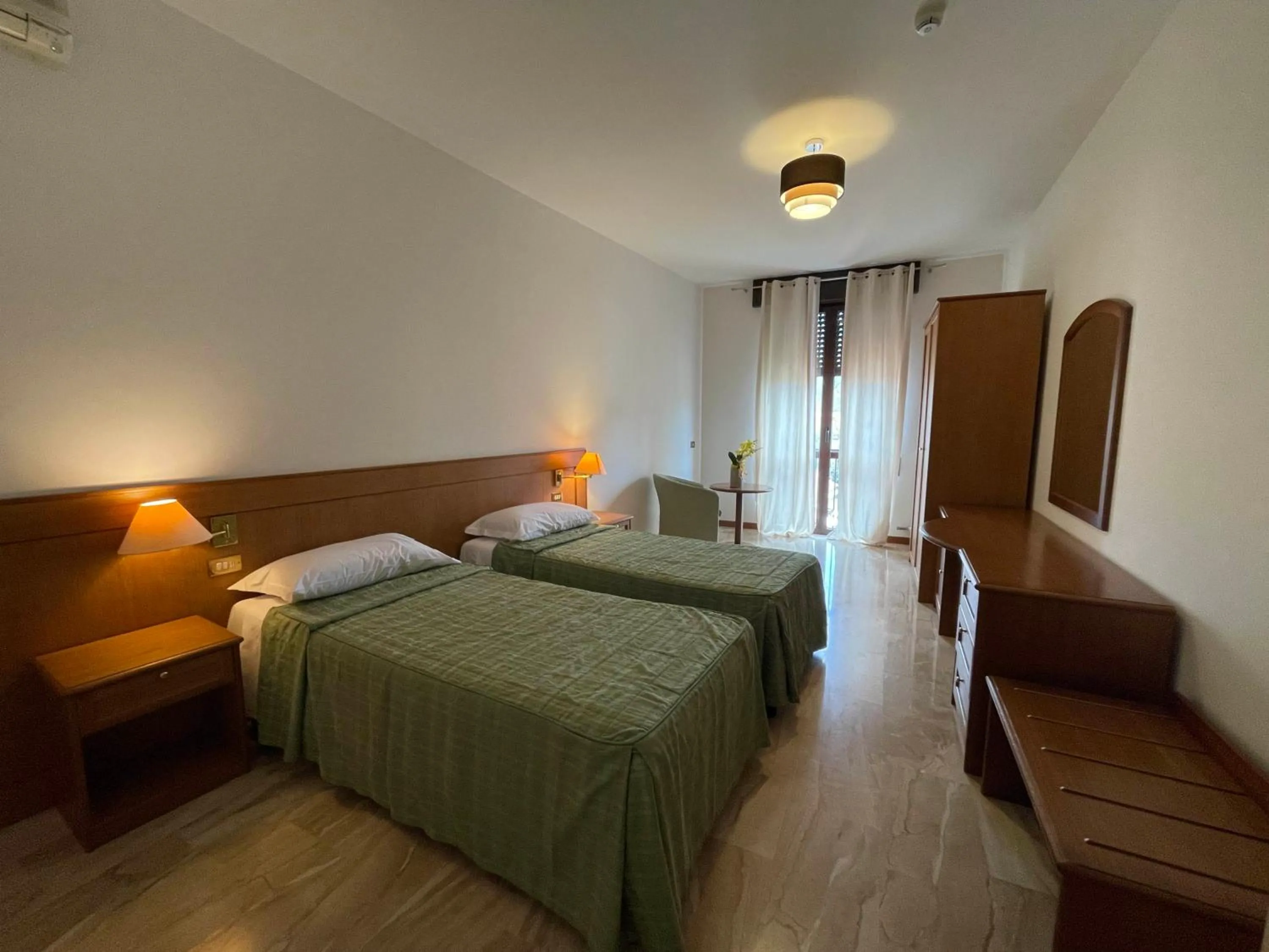Bed in Hotel Clementi