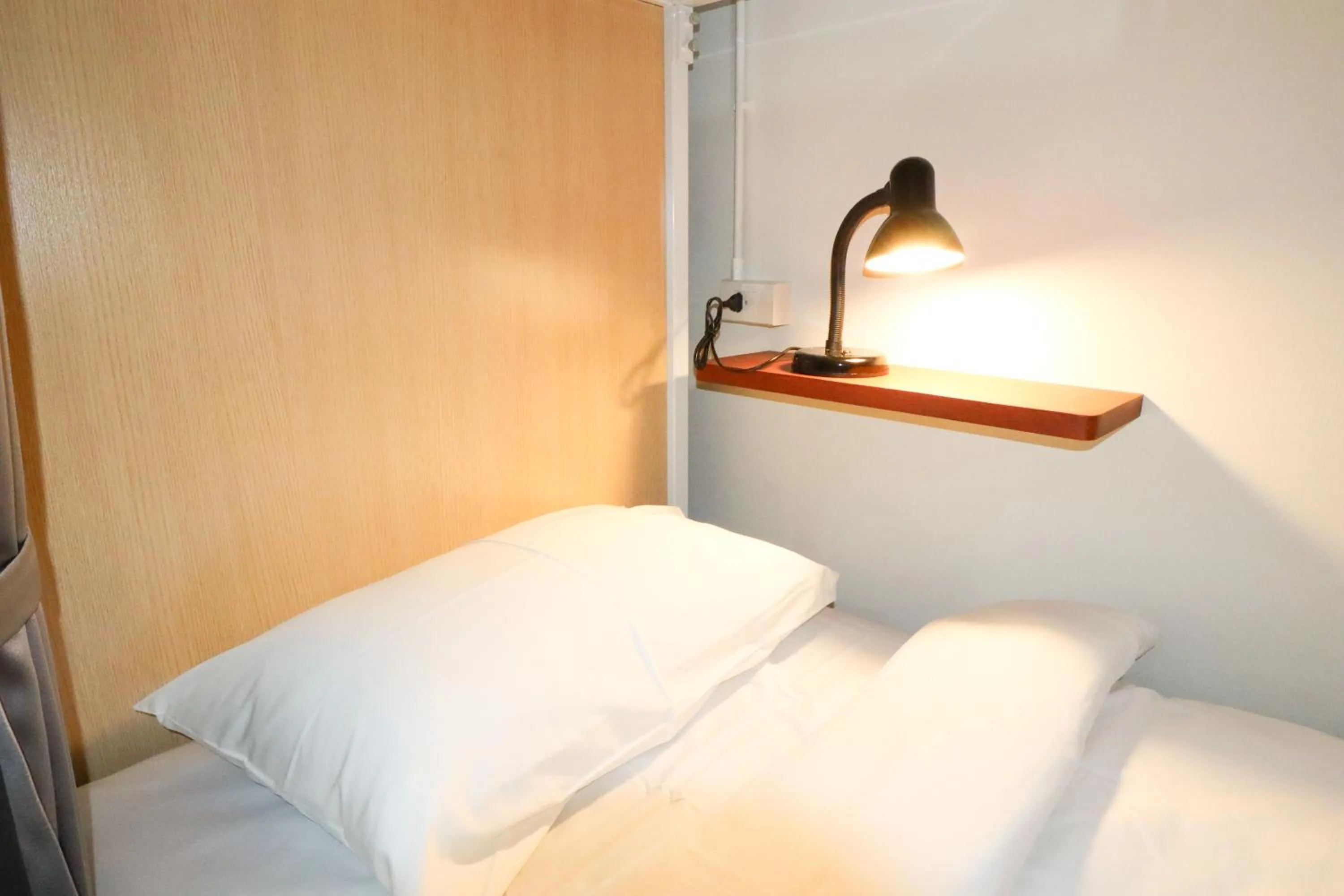 Bed in Vintana Siam Bangkok Hotel