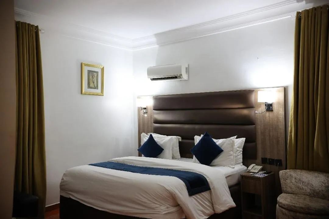 Bed in Bolton White Residence