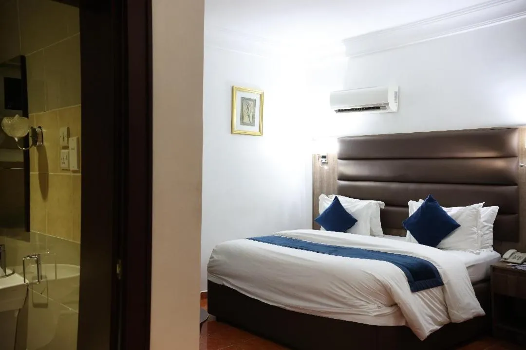 Bed in Bolton White Residence