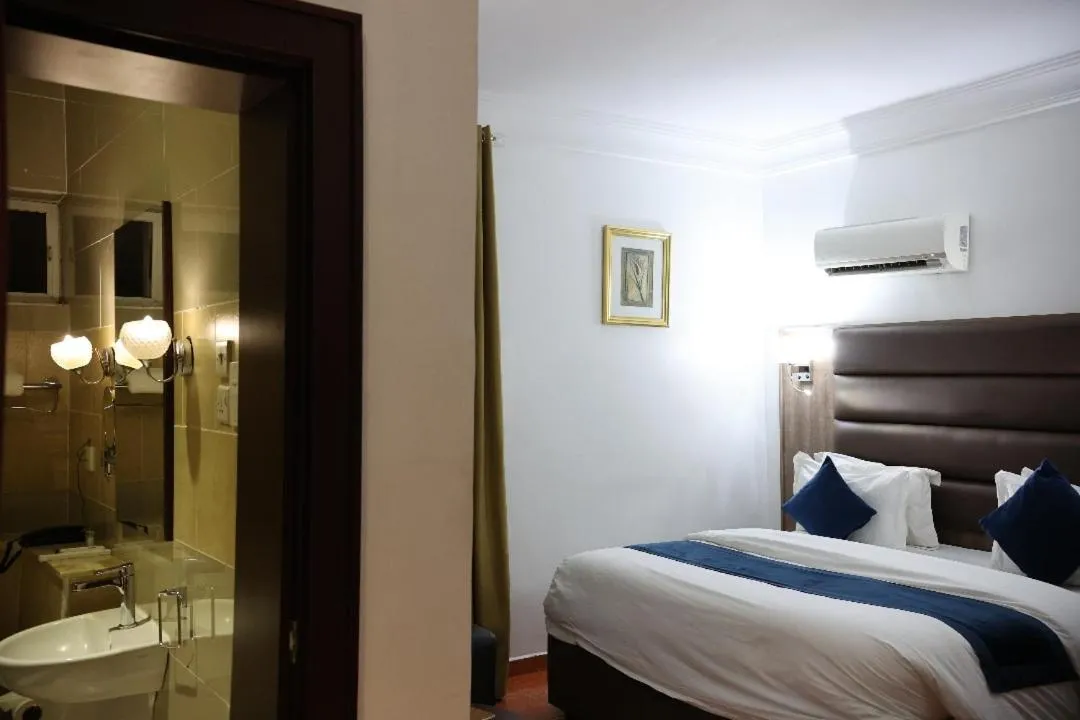 Bed in Bolton White Residence