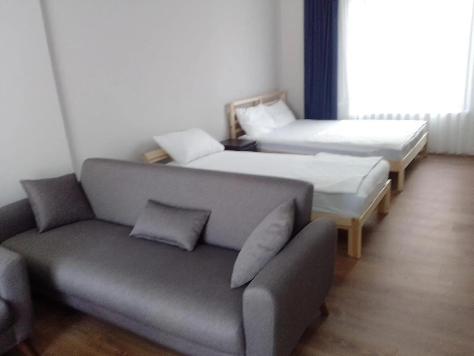 Seating area, Bed in ROSe OTEL