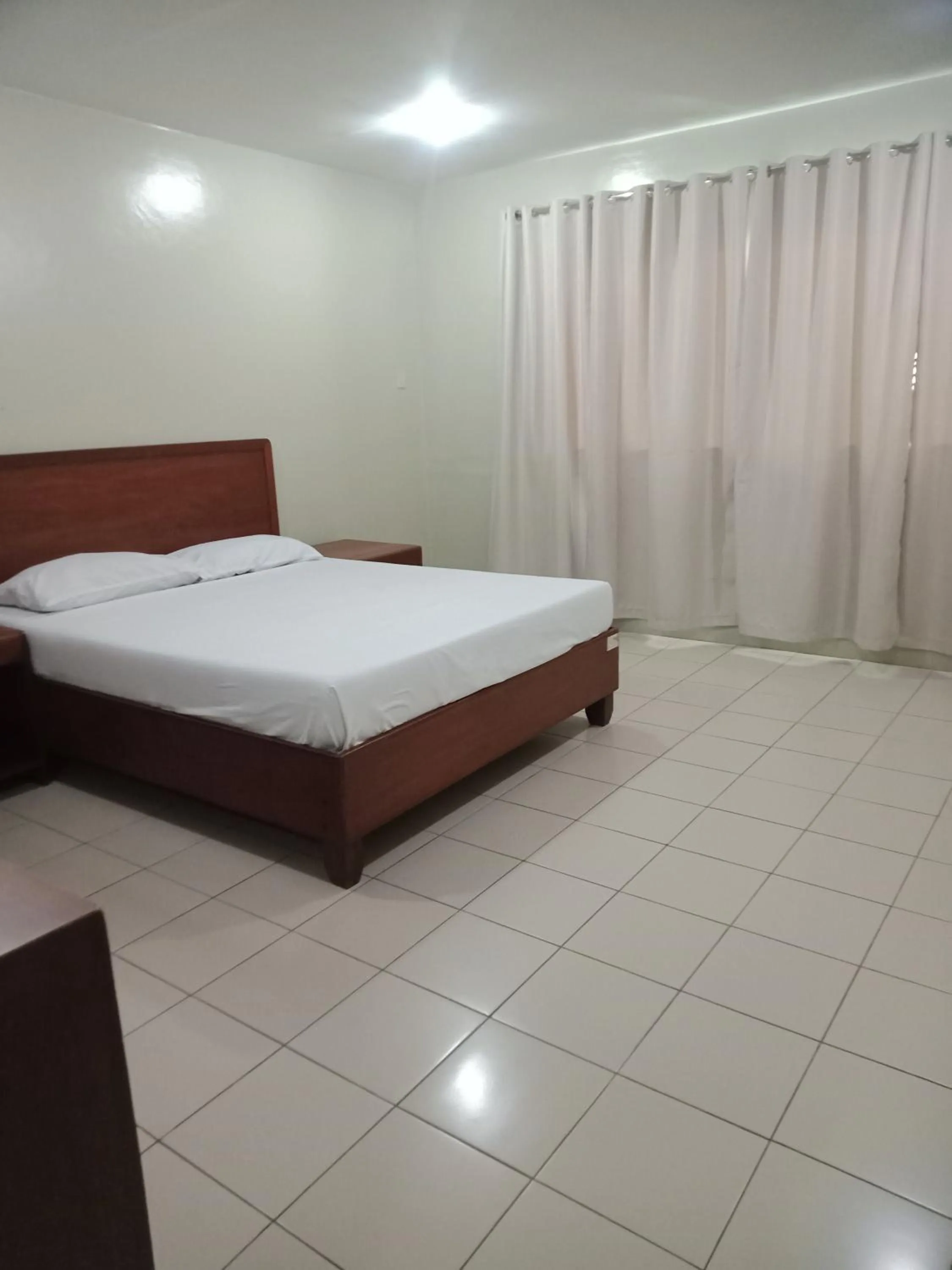 Bed in Joyce Apartelle San Juan