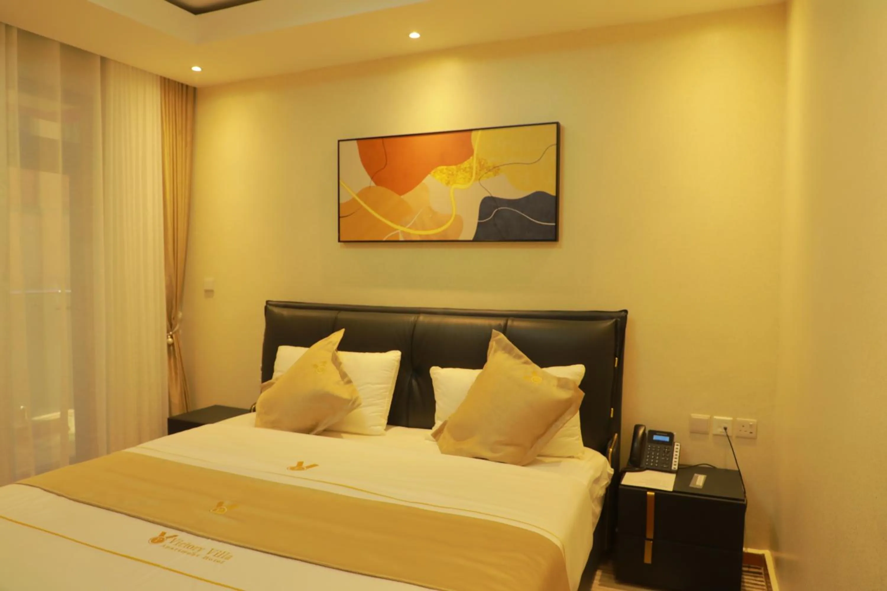 Bed in Victory Villa Apartment hotel