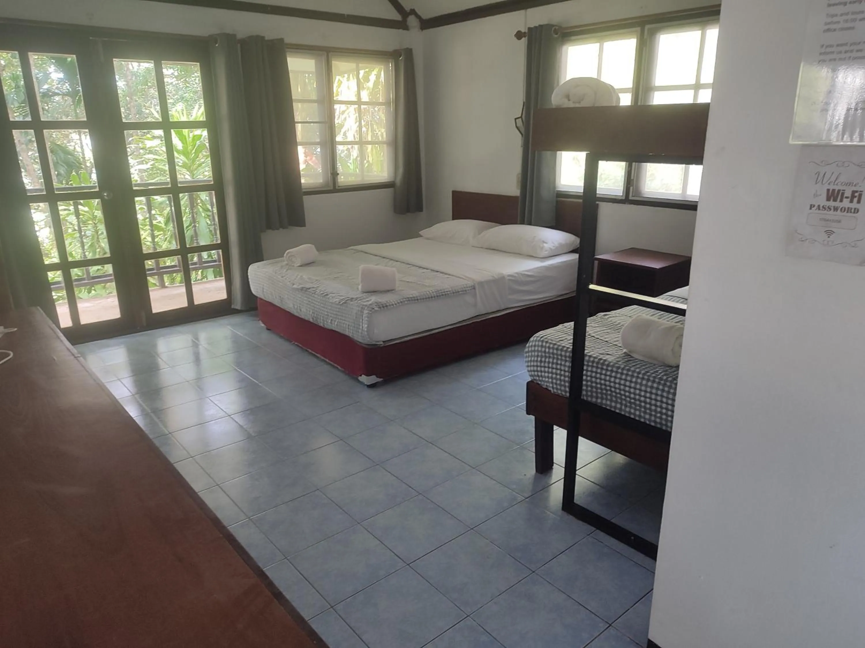 Bed in Poseidon Bungalows