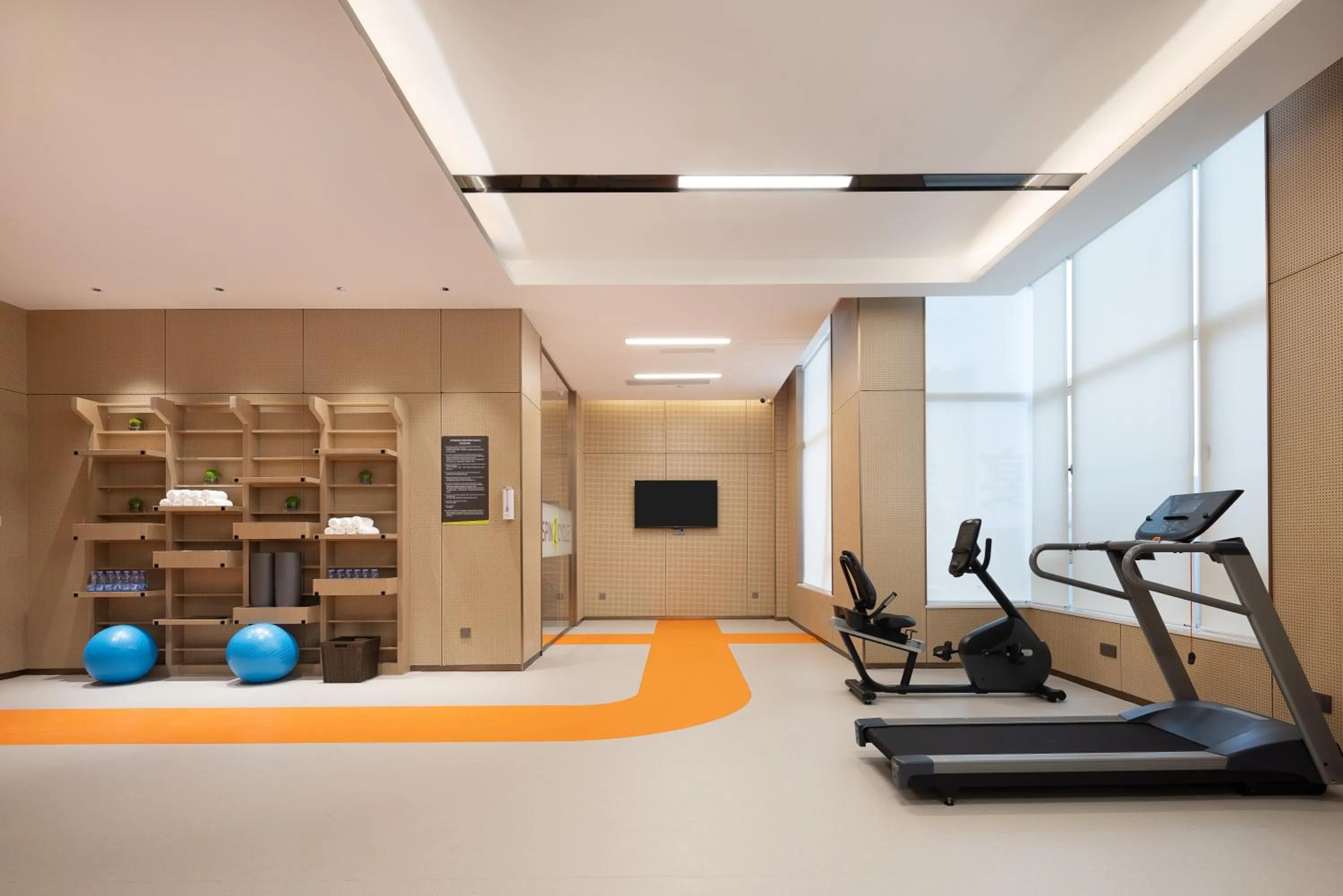 Fitness centre/facilities in Home2 Suite by Hilton Fuyang Taihe