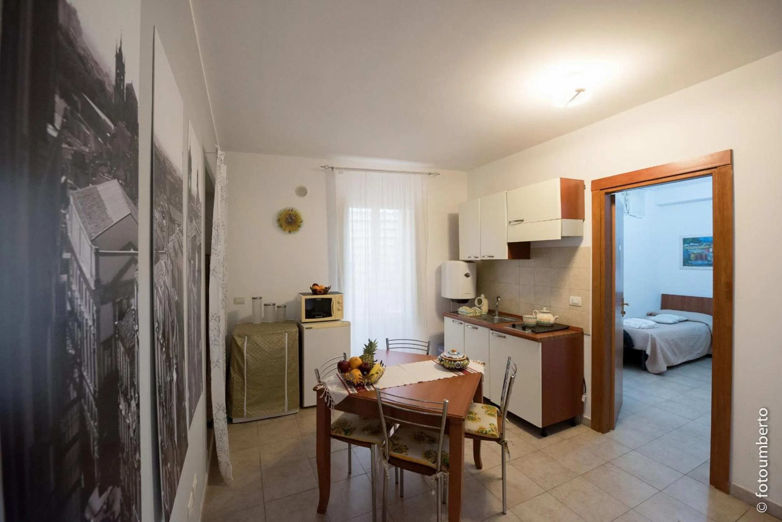 Communal lounge/ TV room, Bed in La Rosa Antica