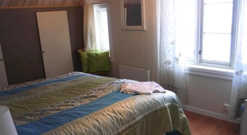 Bed in Jordbærstova Feriehus