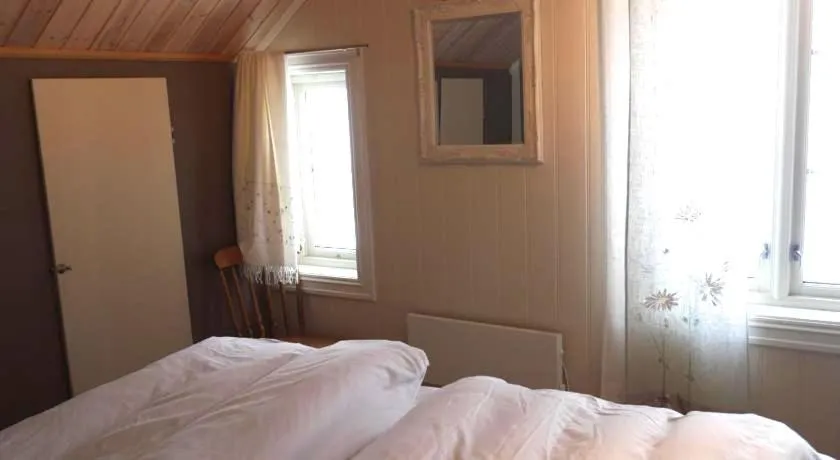 Bed in Jordbærstova Feriehus