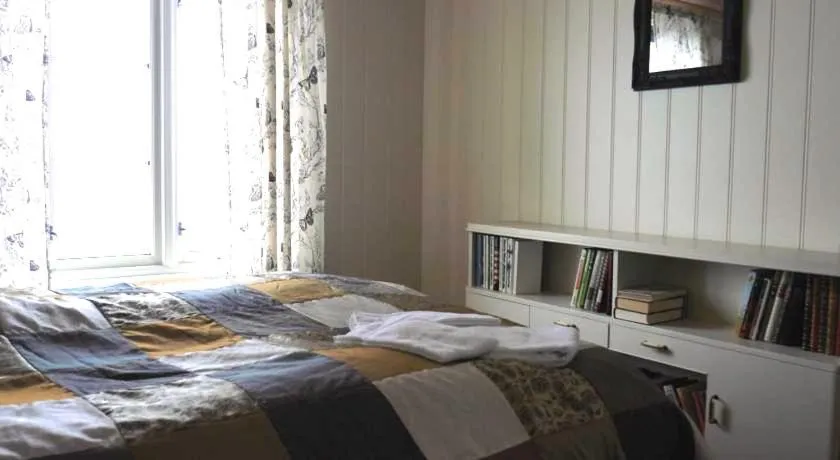 Bed in Jordbærstova Feriehus