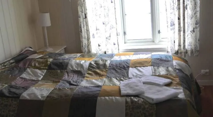 Bed in Jordbærstova Feriehus
