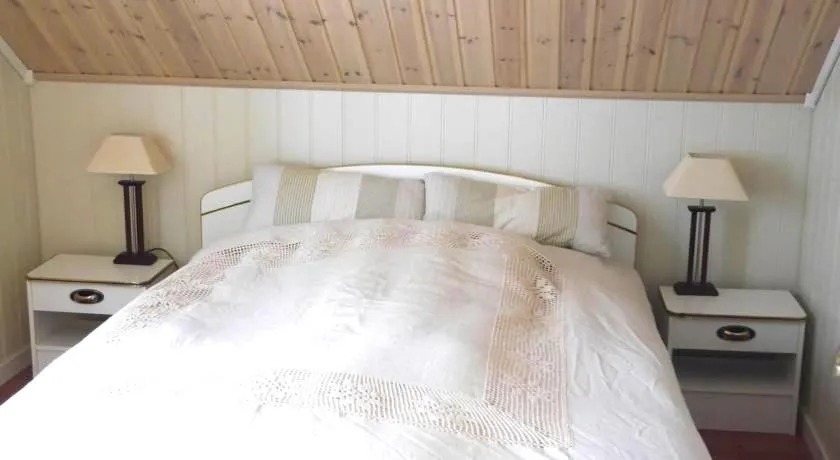 Bed in Jordbærstova Feriehus