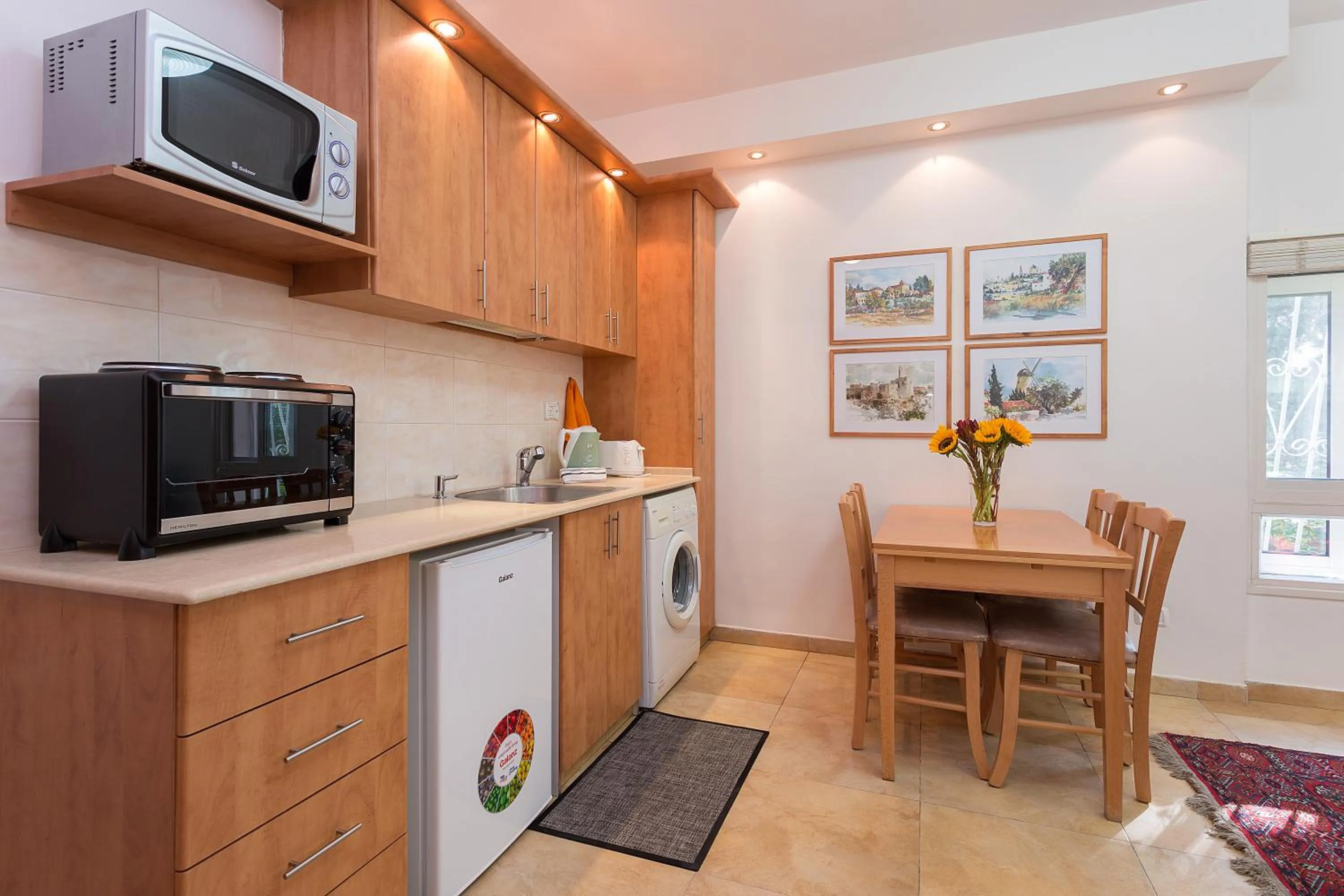 Kitchen or kitchenette in Colony Suites- Hananya St.