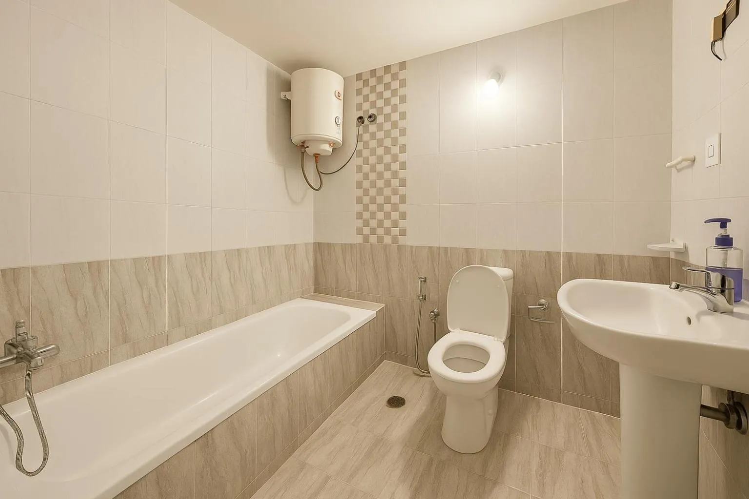 Shower in HosteLife Brookfield By De Royale Hotels