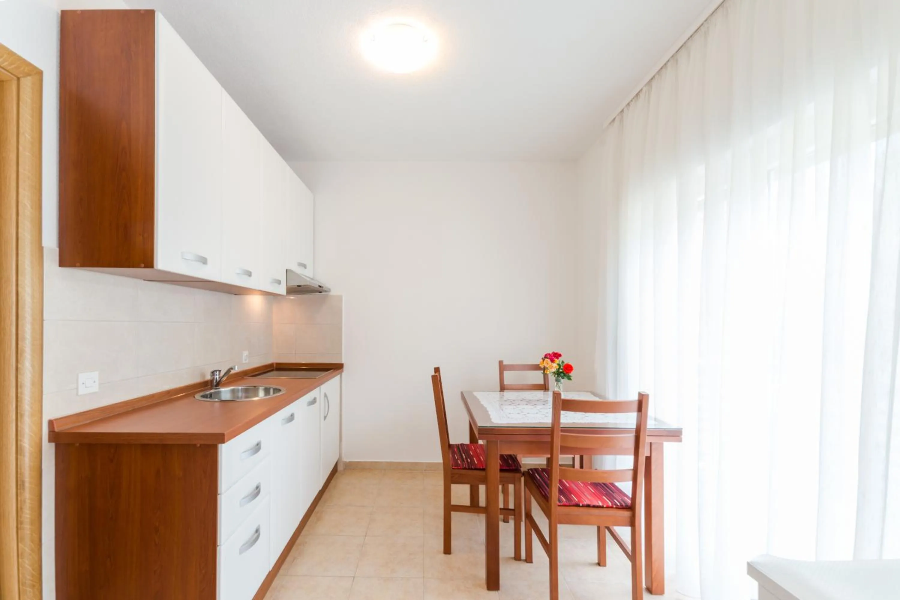 Kitchen or kitchenette in Apartments Brekalo