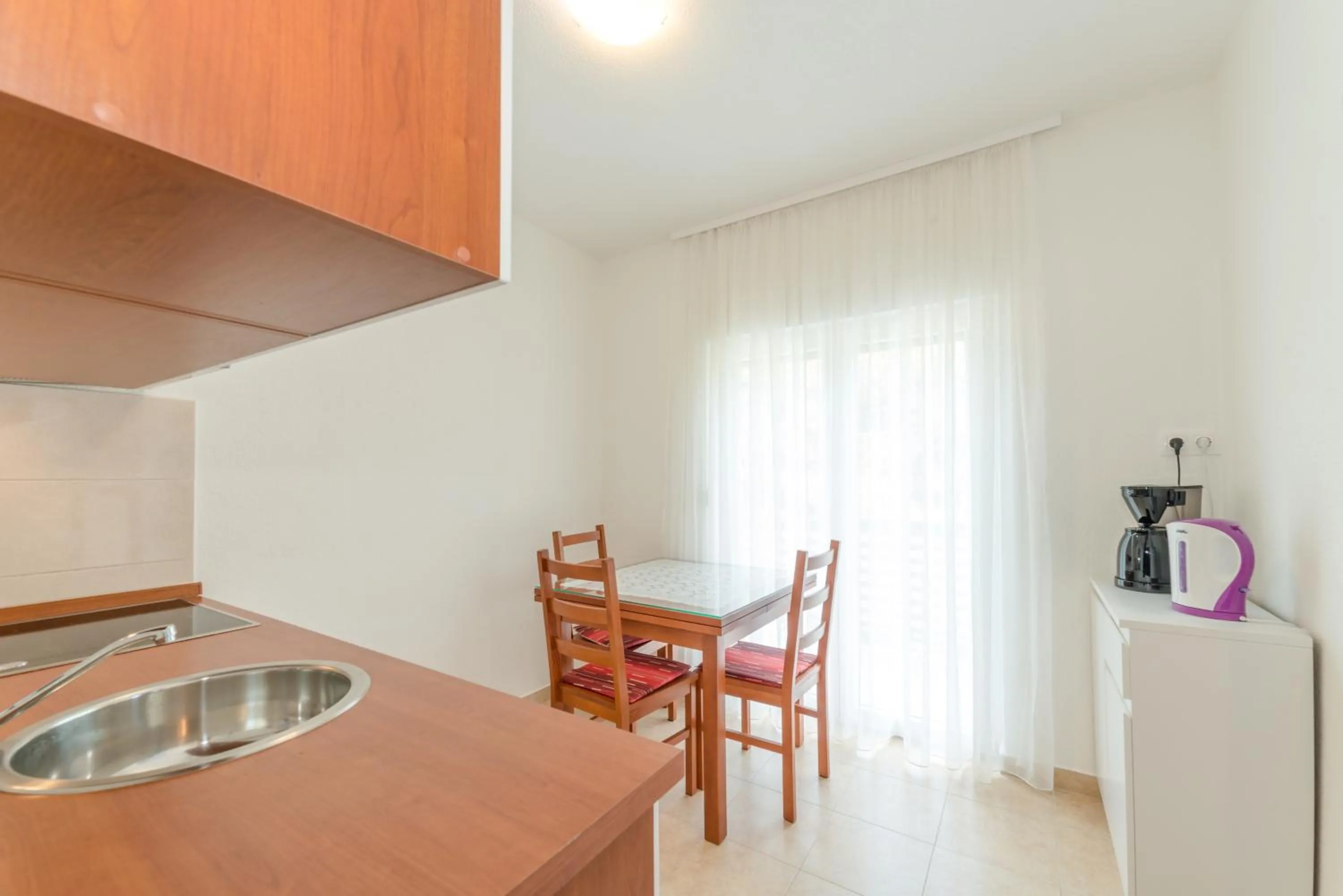 Kitchen or kitchenette in Apartments Brekalo