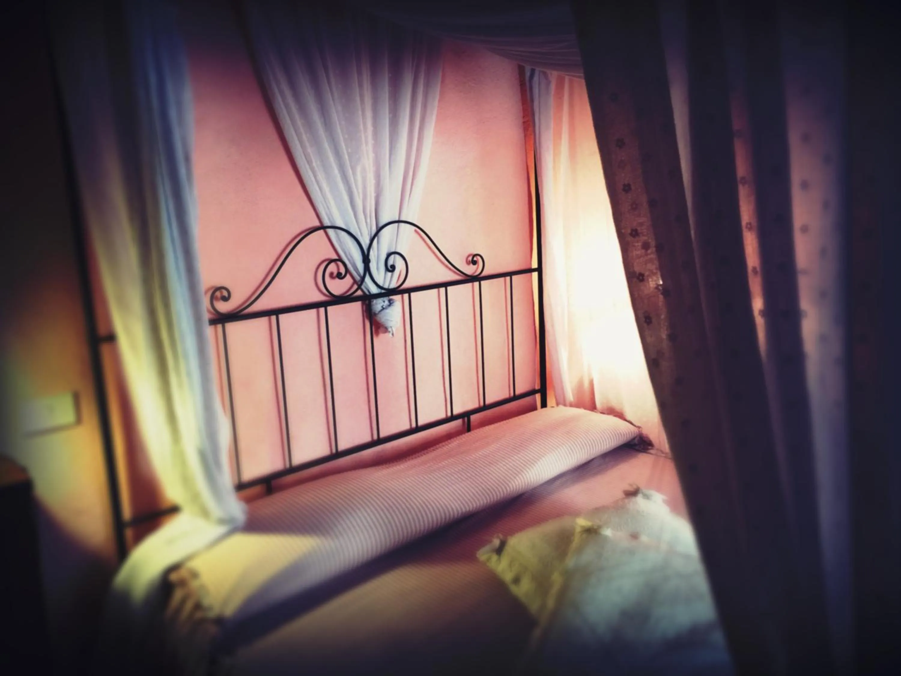 Decorative detail, Bed in La Locanda del Loggiato