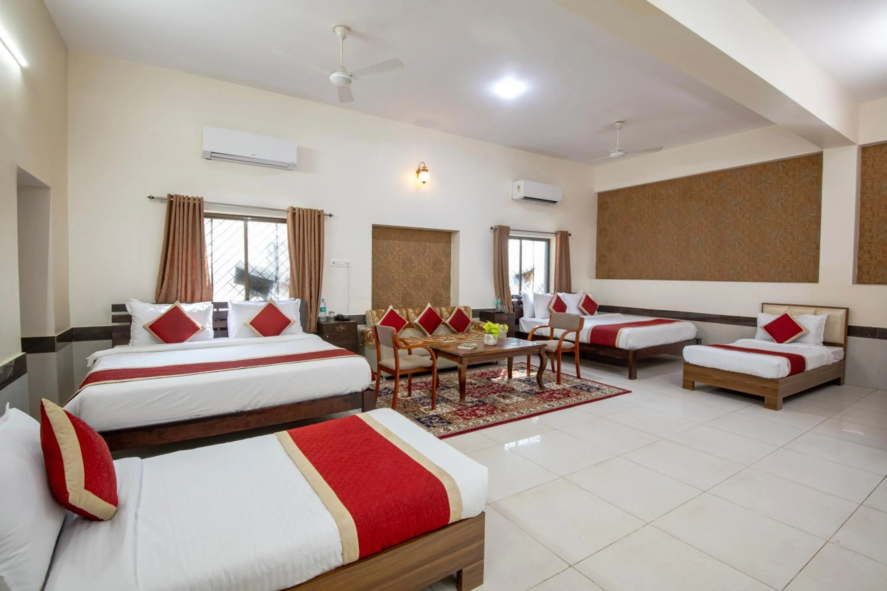 Seating area, Bed in Deora Resort and Hotel