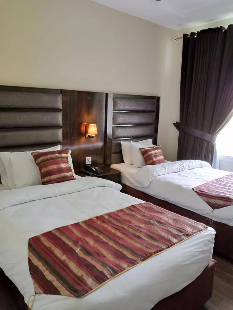 Photo of the whole room, Bed in Legend Hotel Hunza