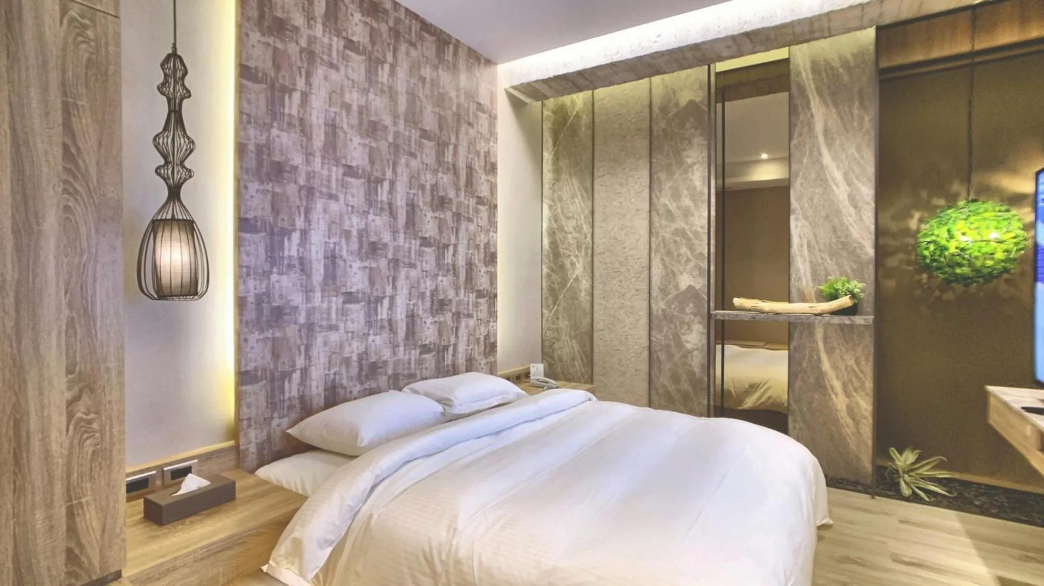 Bed in JBG Hotspring Resort Hotel