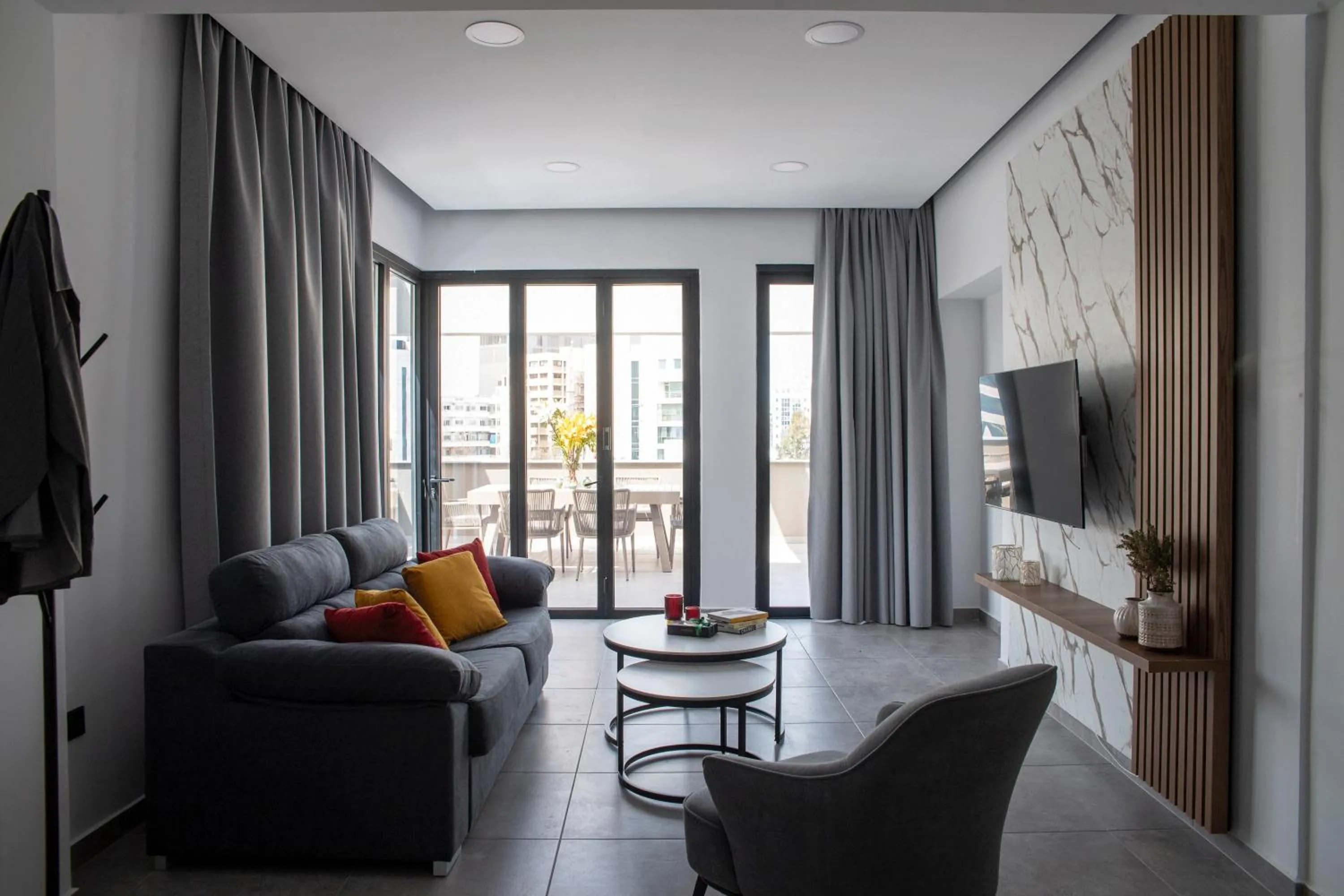 Communal lounge/ TV room in Le Bouquet Luxury Suites Ltd