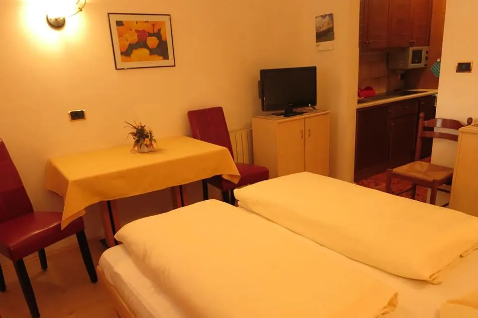 Bed in Apartments Residence Montana