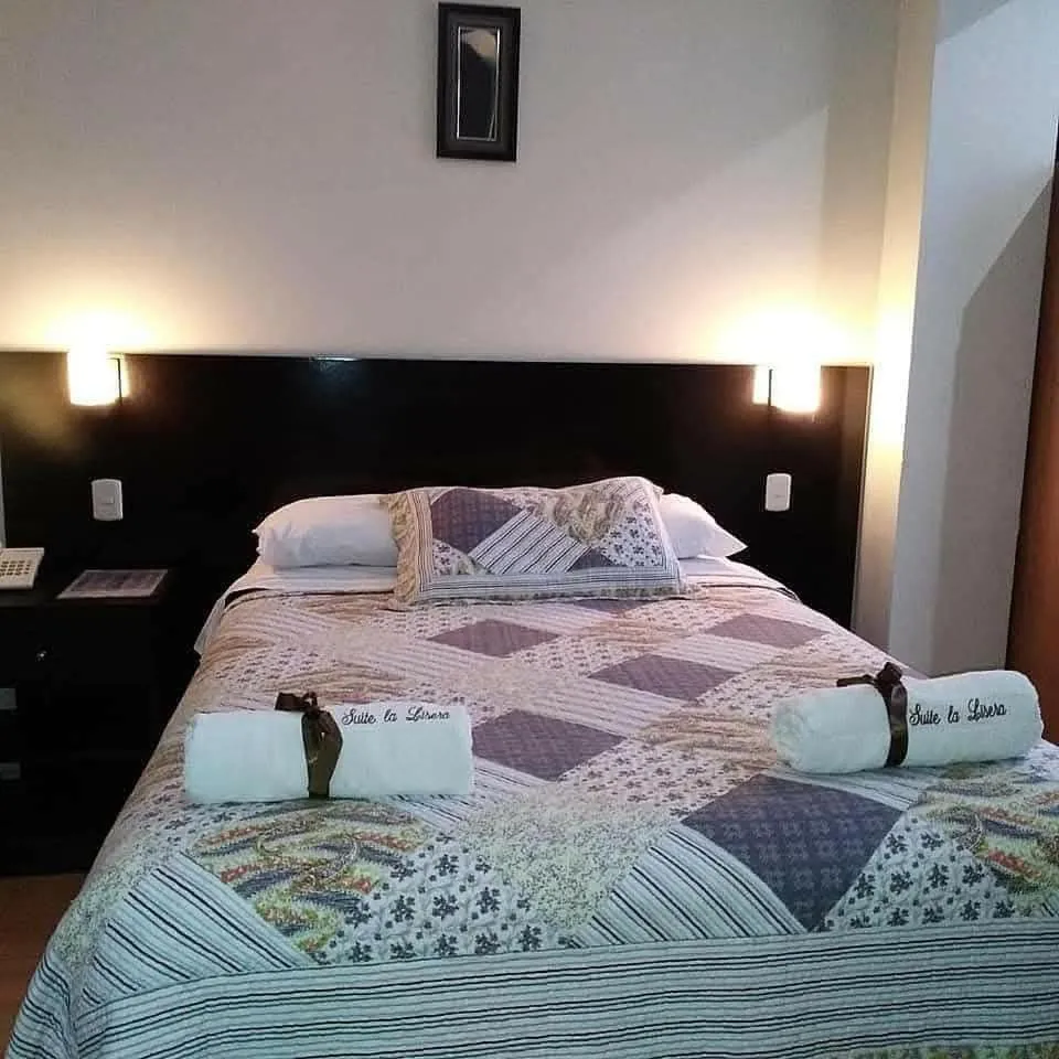 Bed in La Lisera Suite Residencial