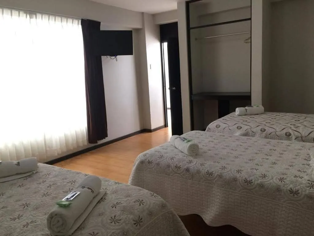 Bed in La Lisera Suite Residencial