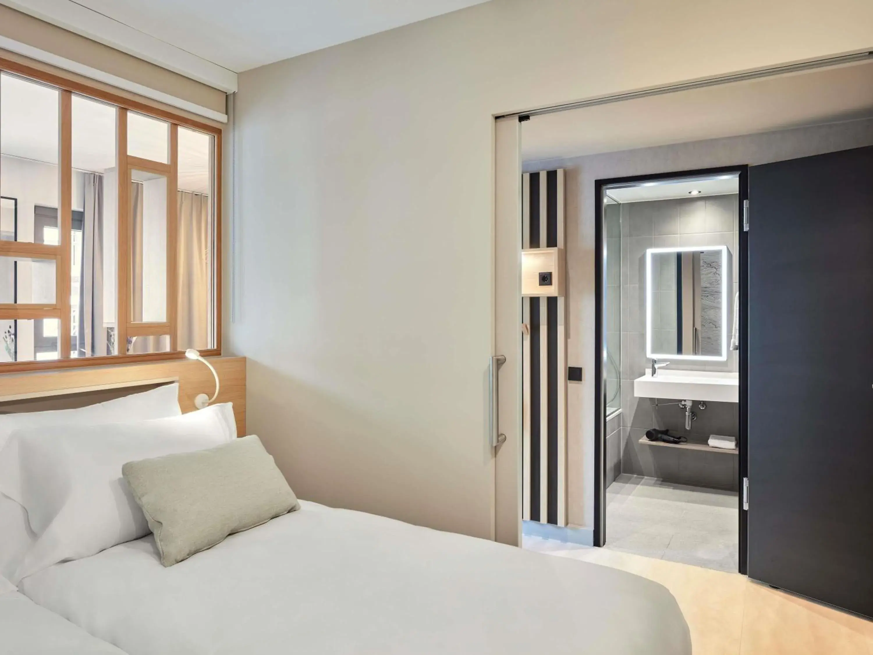 Bedroom, Bed in Aparthotel Adagio Stuttgart NeckarPark Bedroom, Bed in Aparthotel Adagio Stuttgart NeckarPark