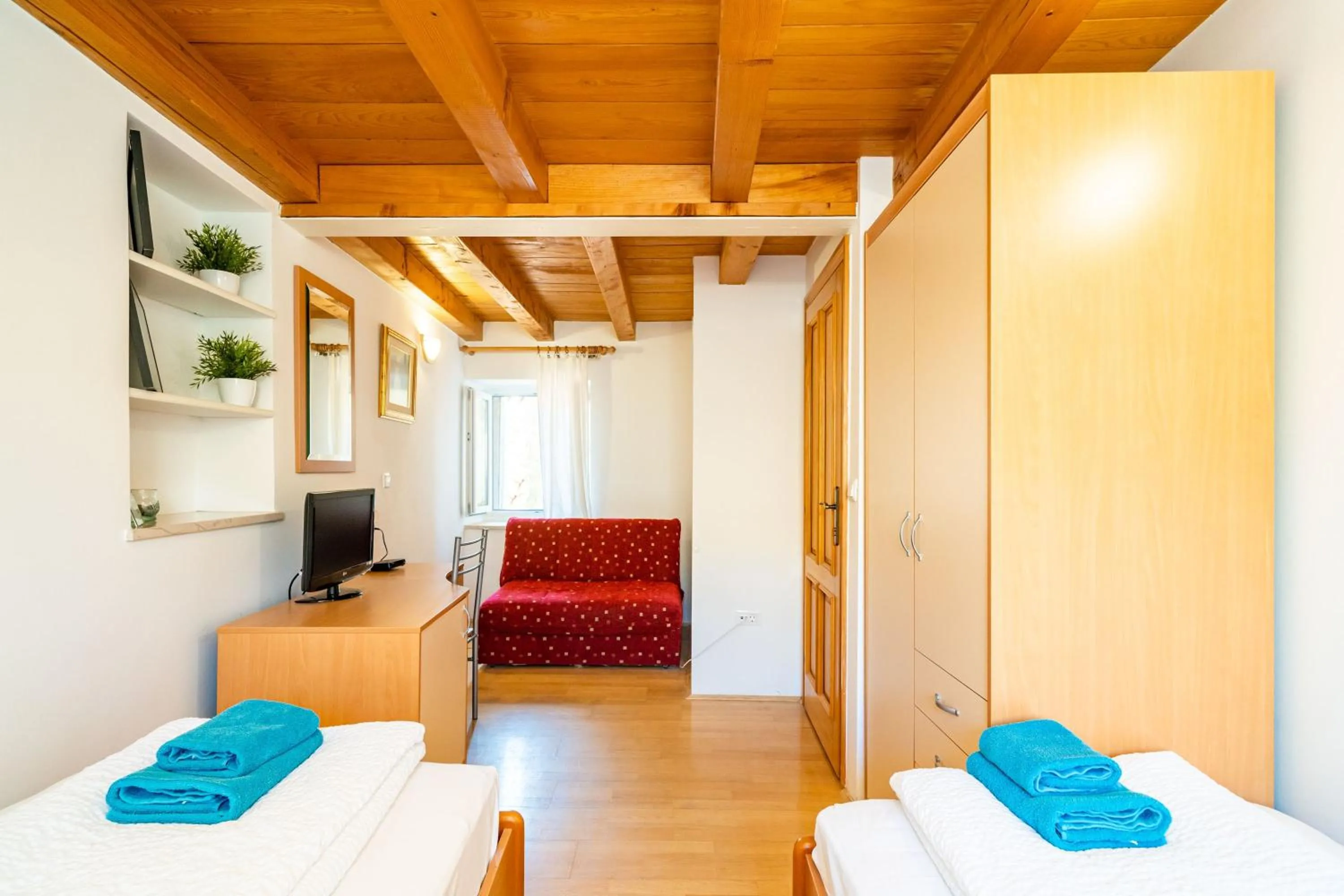 Living room, Bed in Foteza Apartments