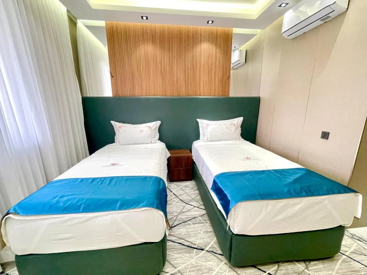 Bed in LakeSide Hotel by EDEN Group