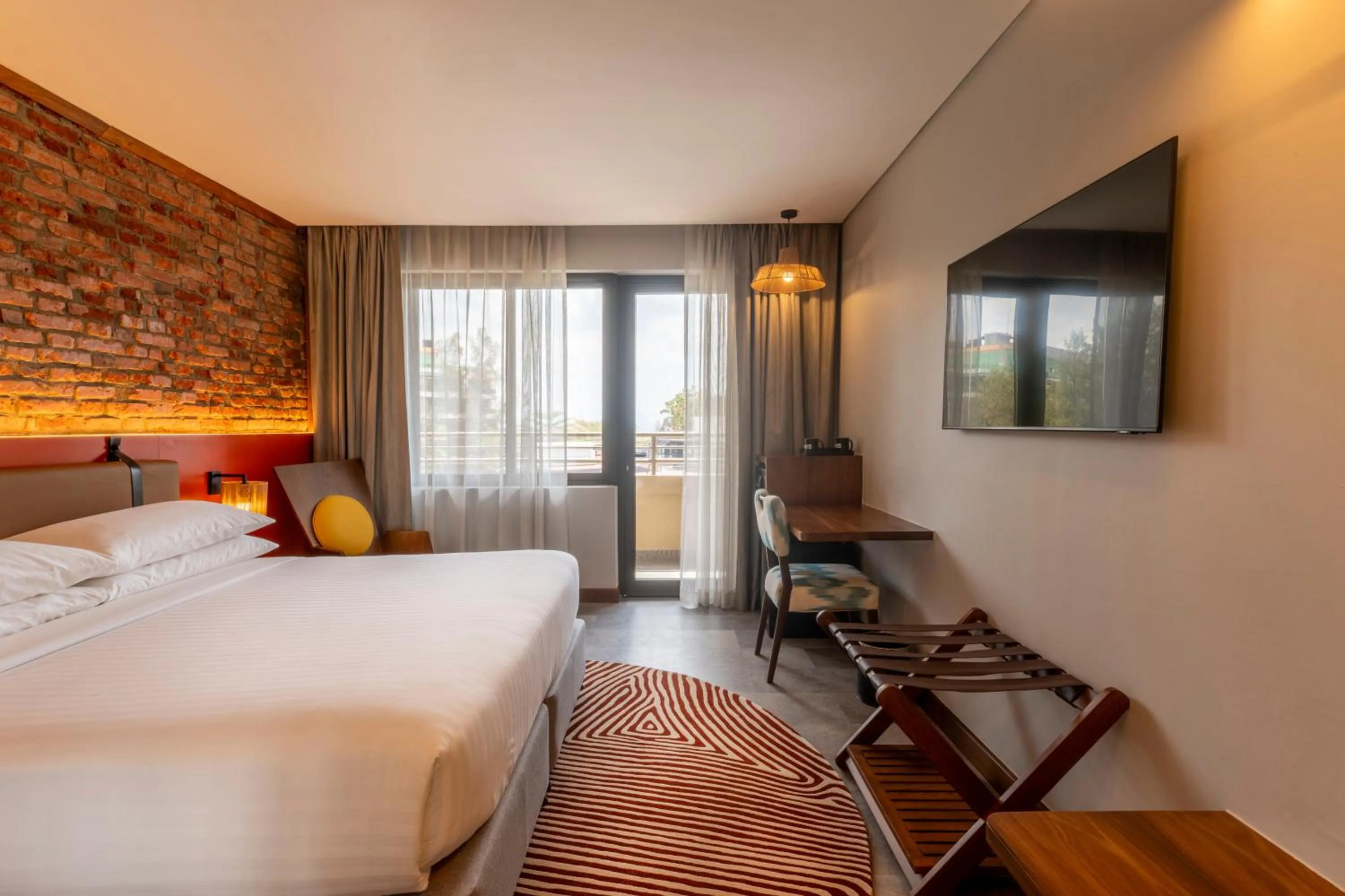 Bed in Zaria Court Kigali, Tapestry Collection by Hilton