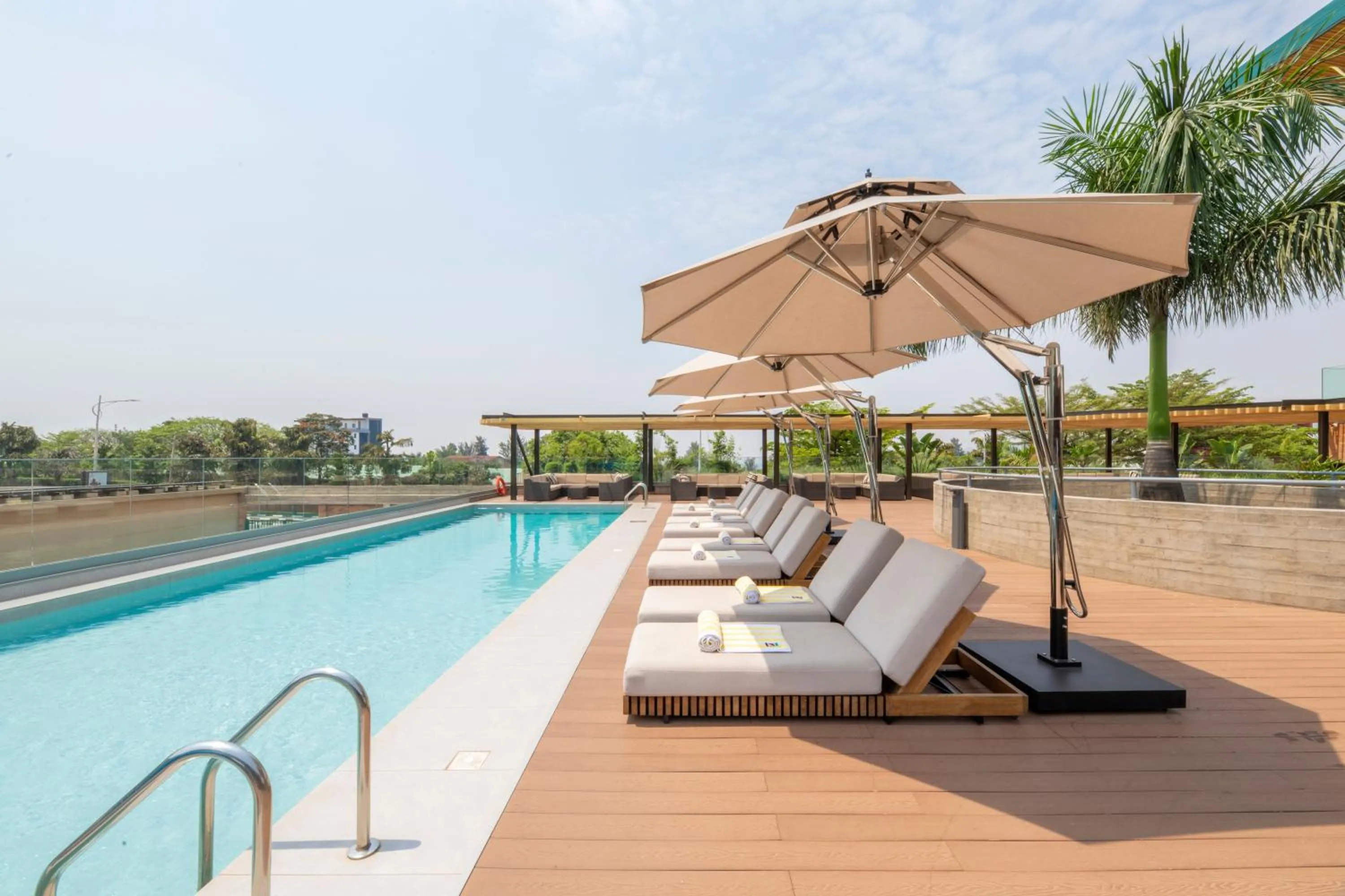 Swimming pool in Zaria Court Kigali, Tapestry Collection by Hilton