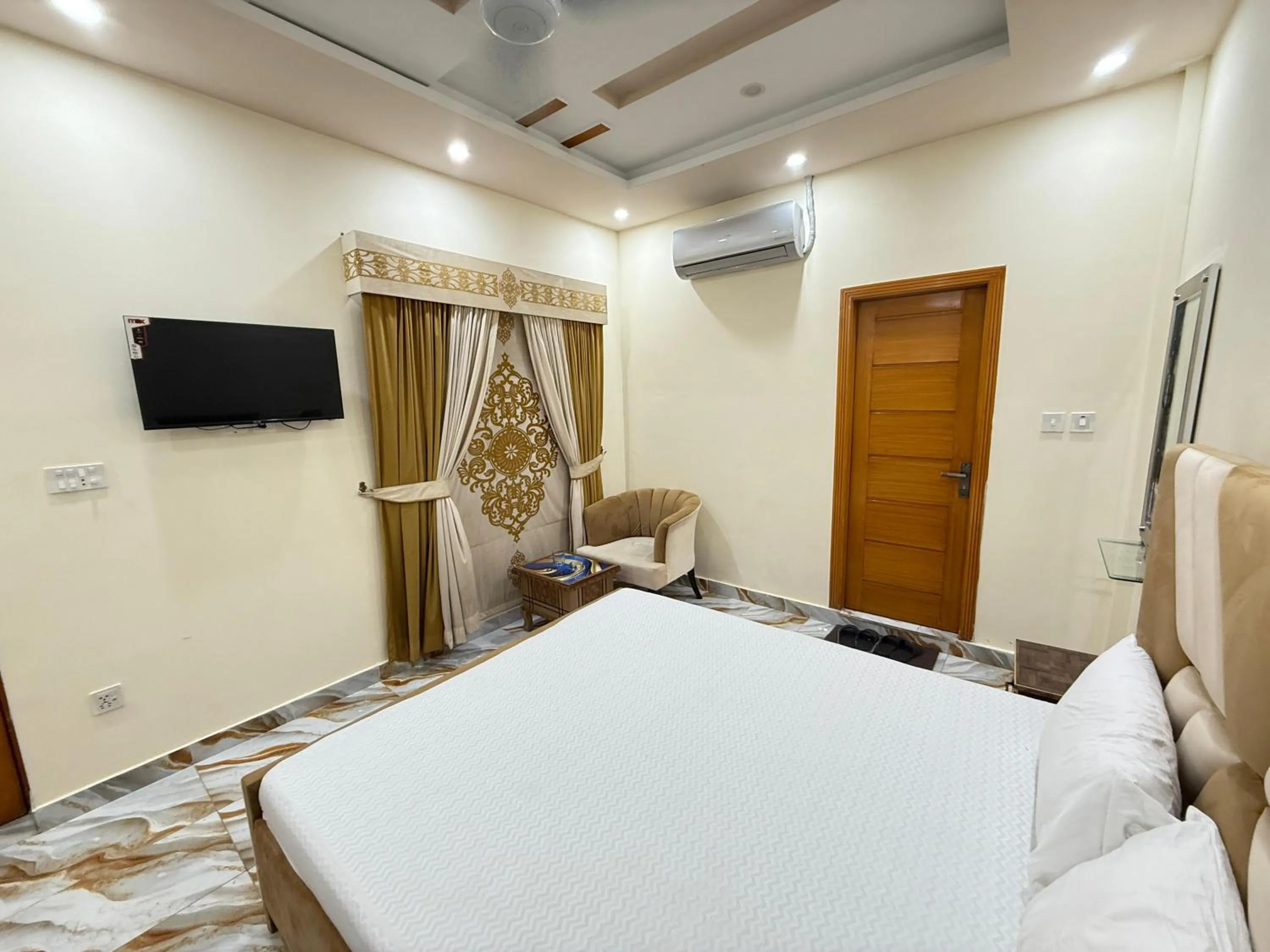 Bed in Serene Elegance Hotel