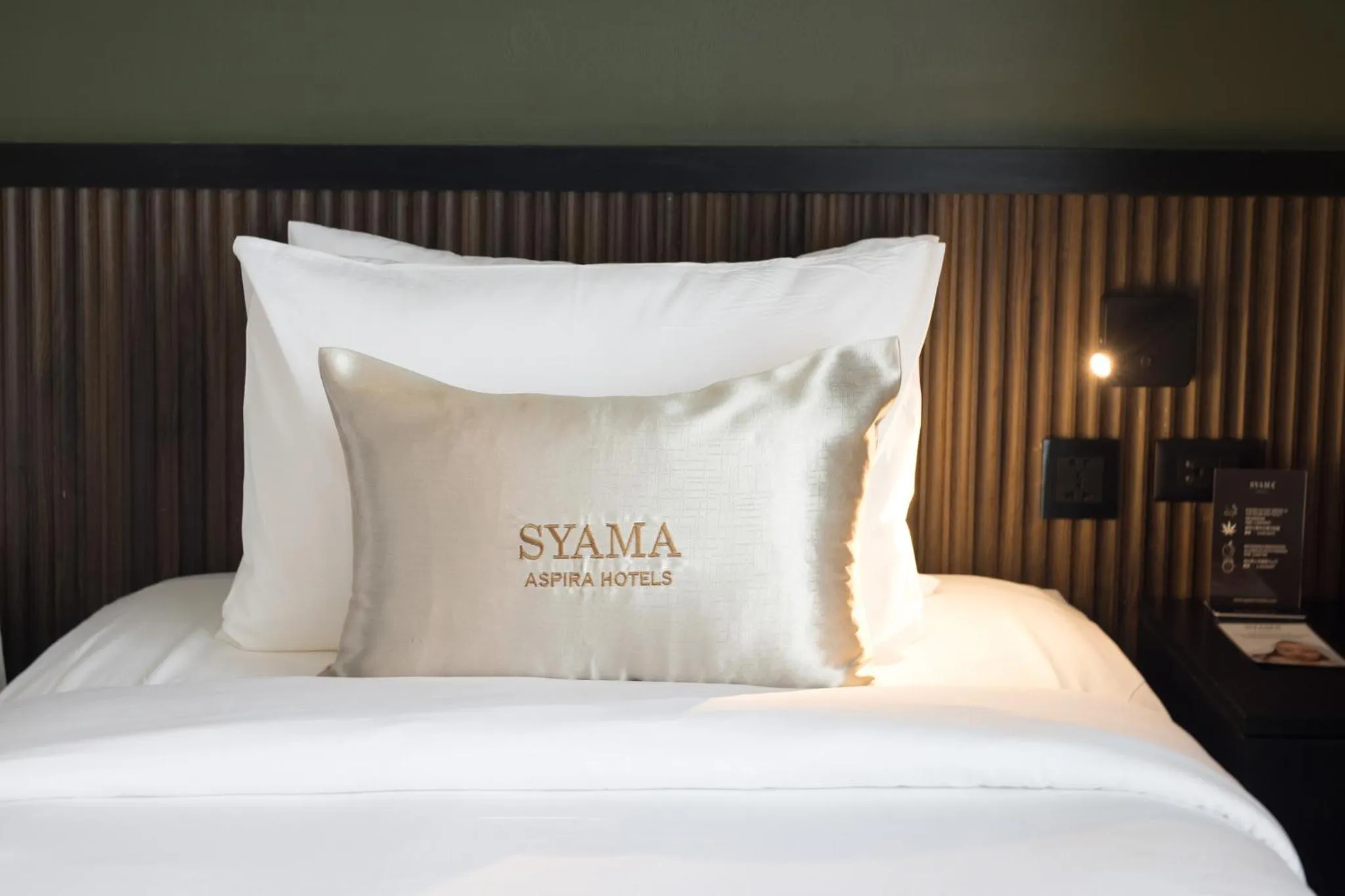 Bed in Syama Mansion Patong, an Aspira Collection