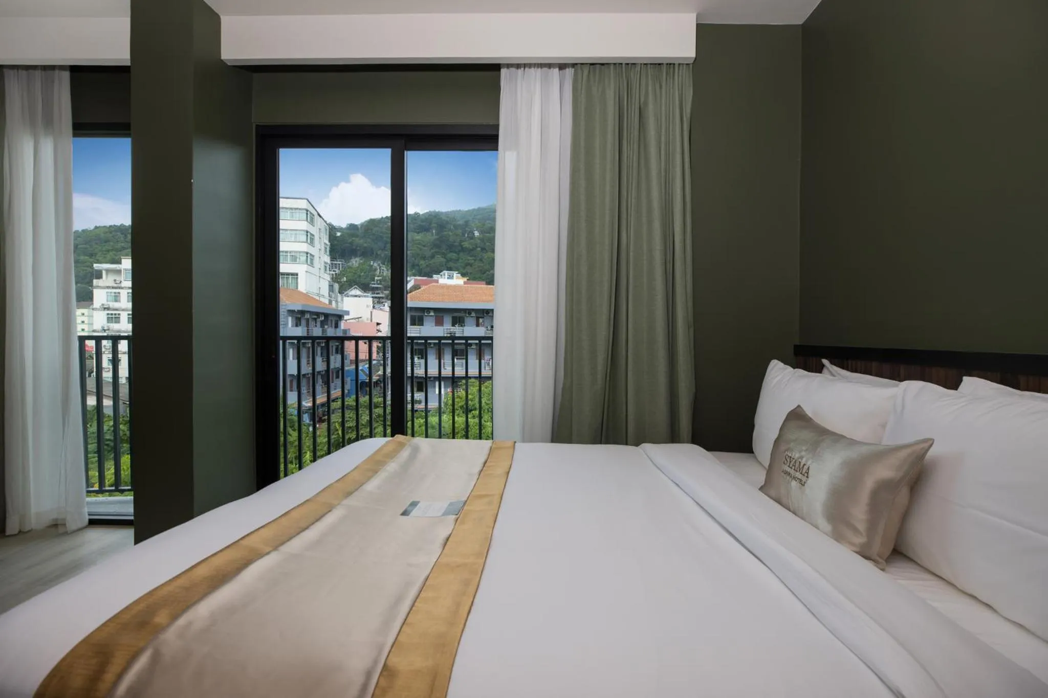 View (from property/room), Bed in Syama Mansion Patong, an Aspira Collection