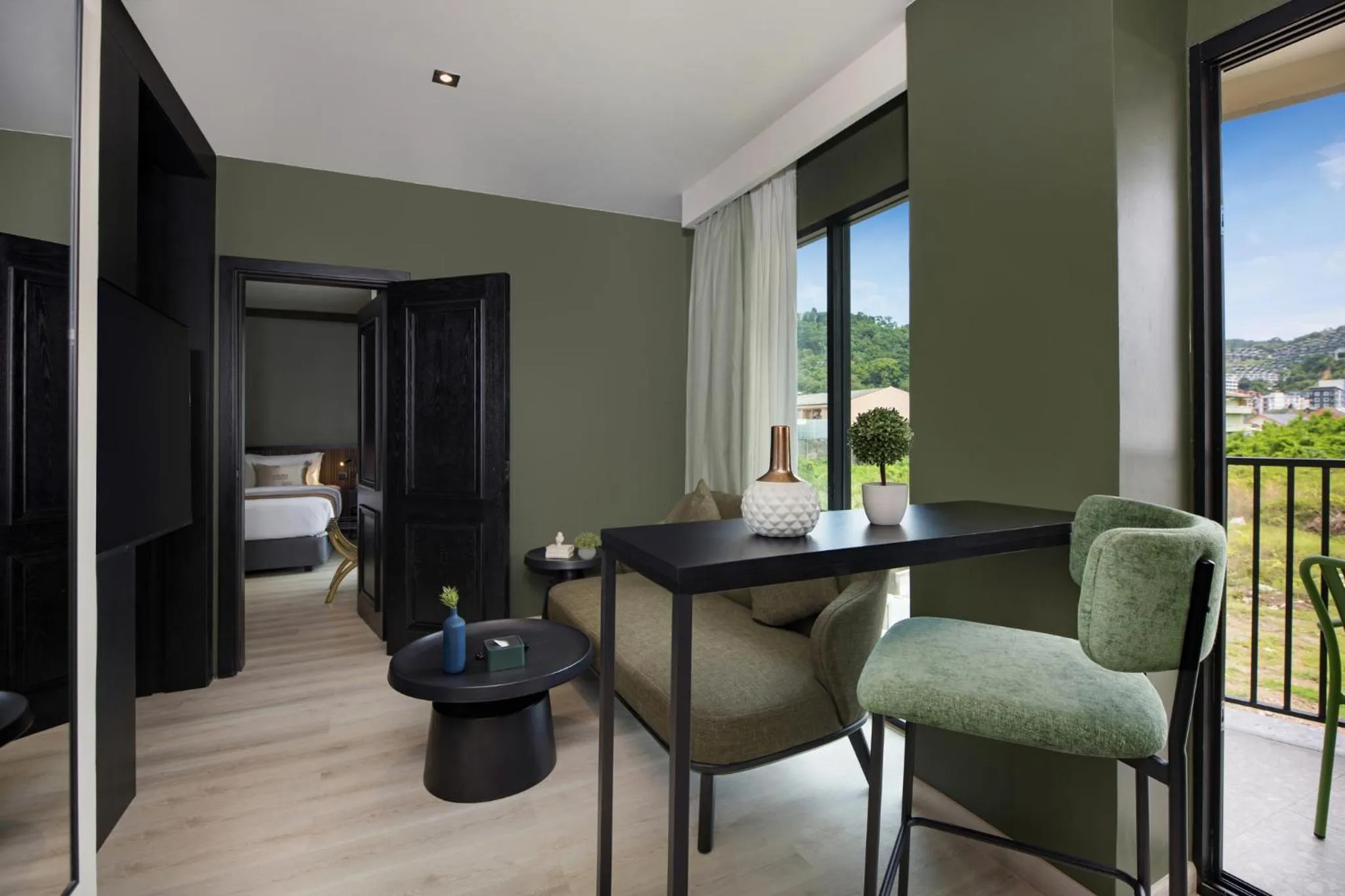 Living room, Bed in Syama Mansion Patong, an Aspira Collection