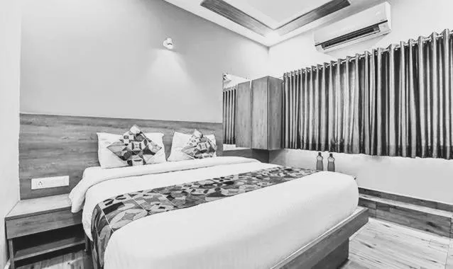 Bed in FabHotel Gokul Villa