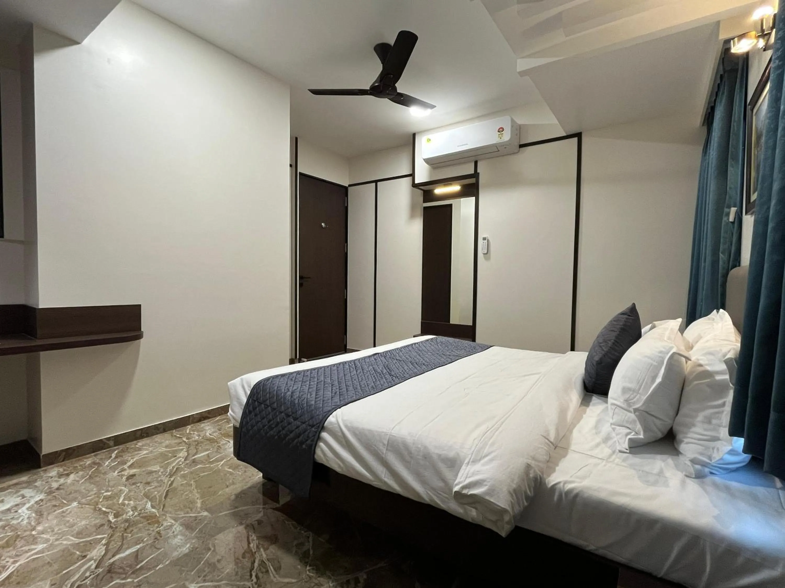 Bed in Kuber Suites