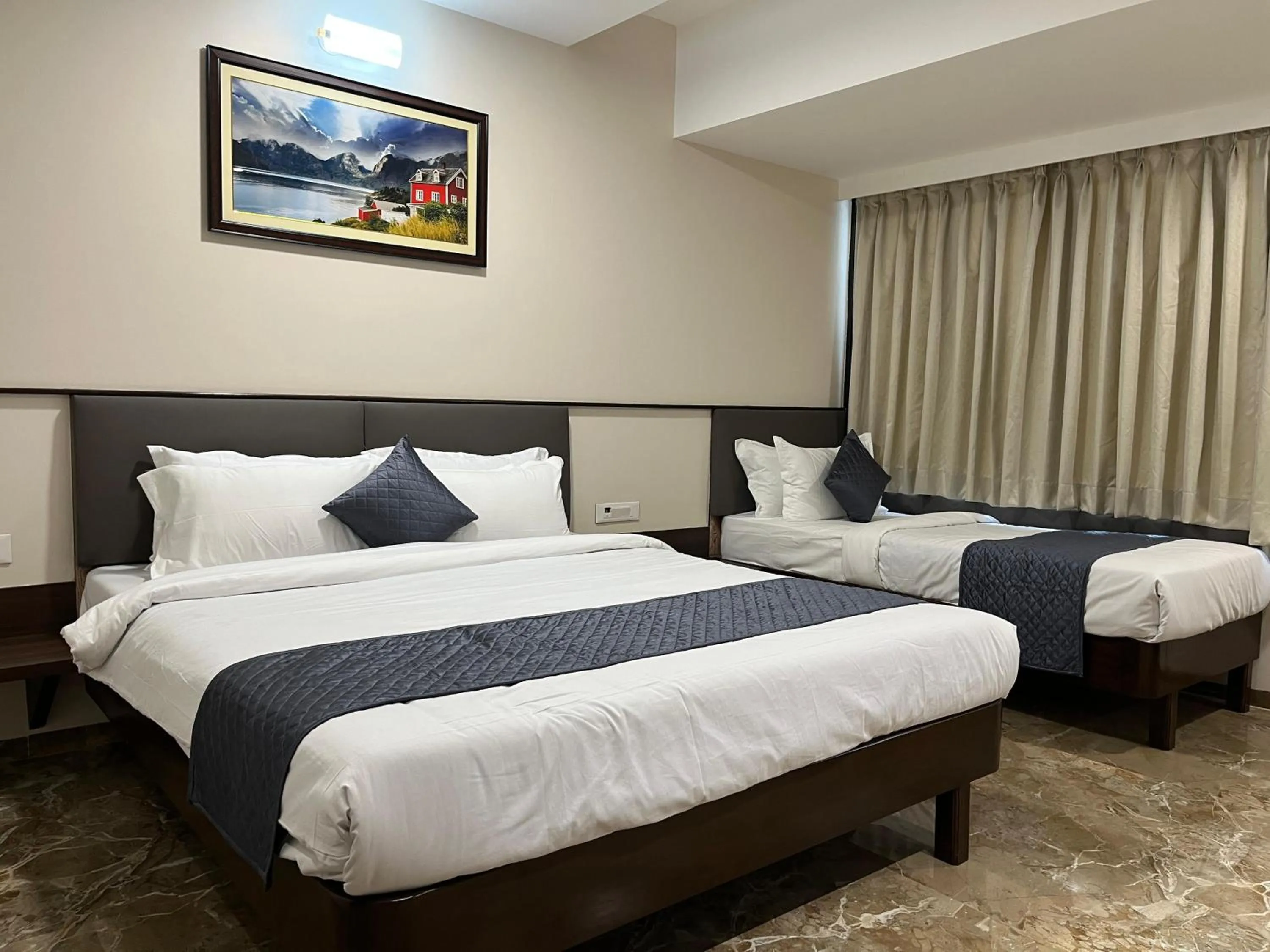 Bed in Kuber Suites