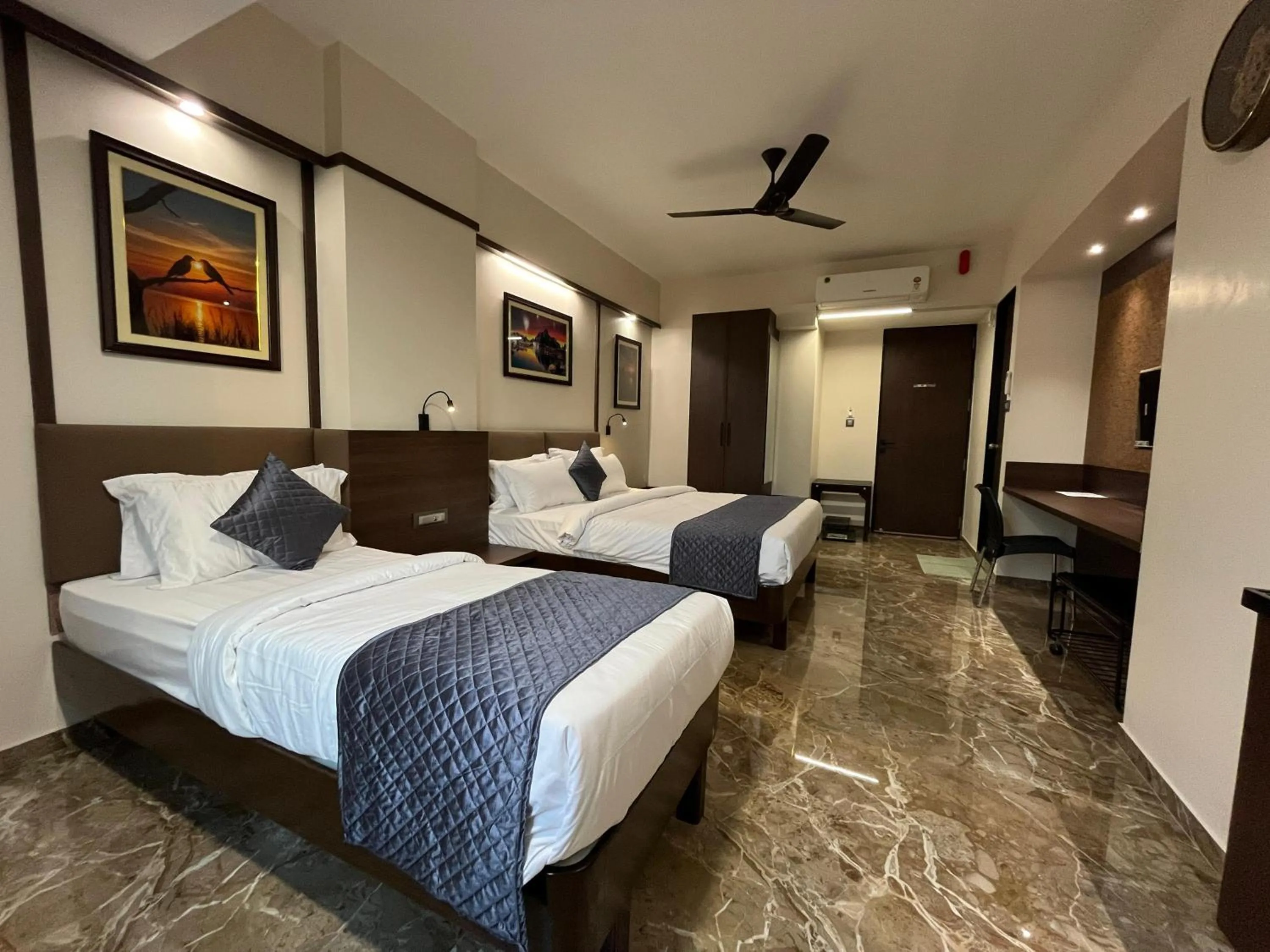 Bed in Kuber Suites