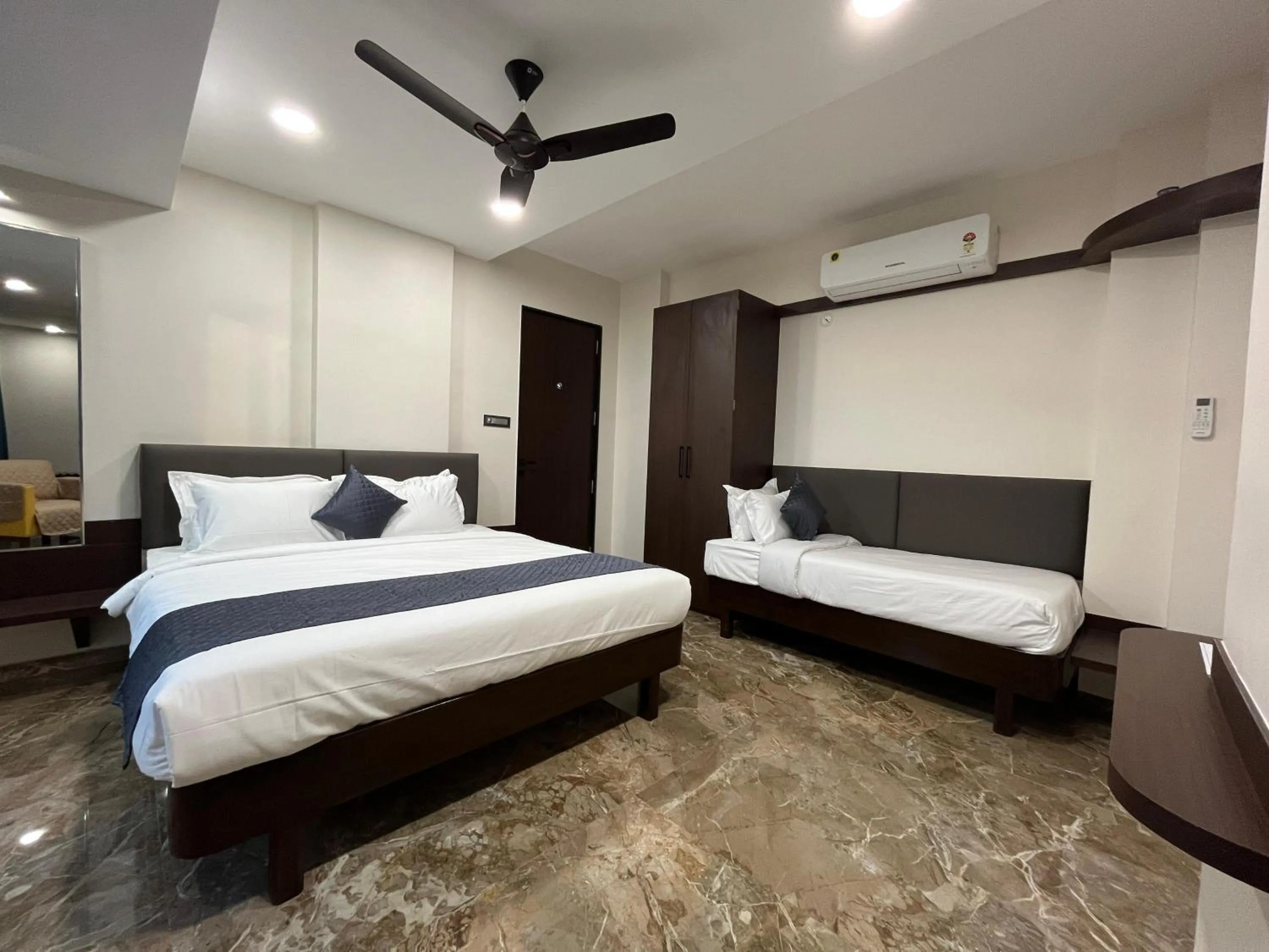 Bed in Kuber Suites