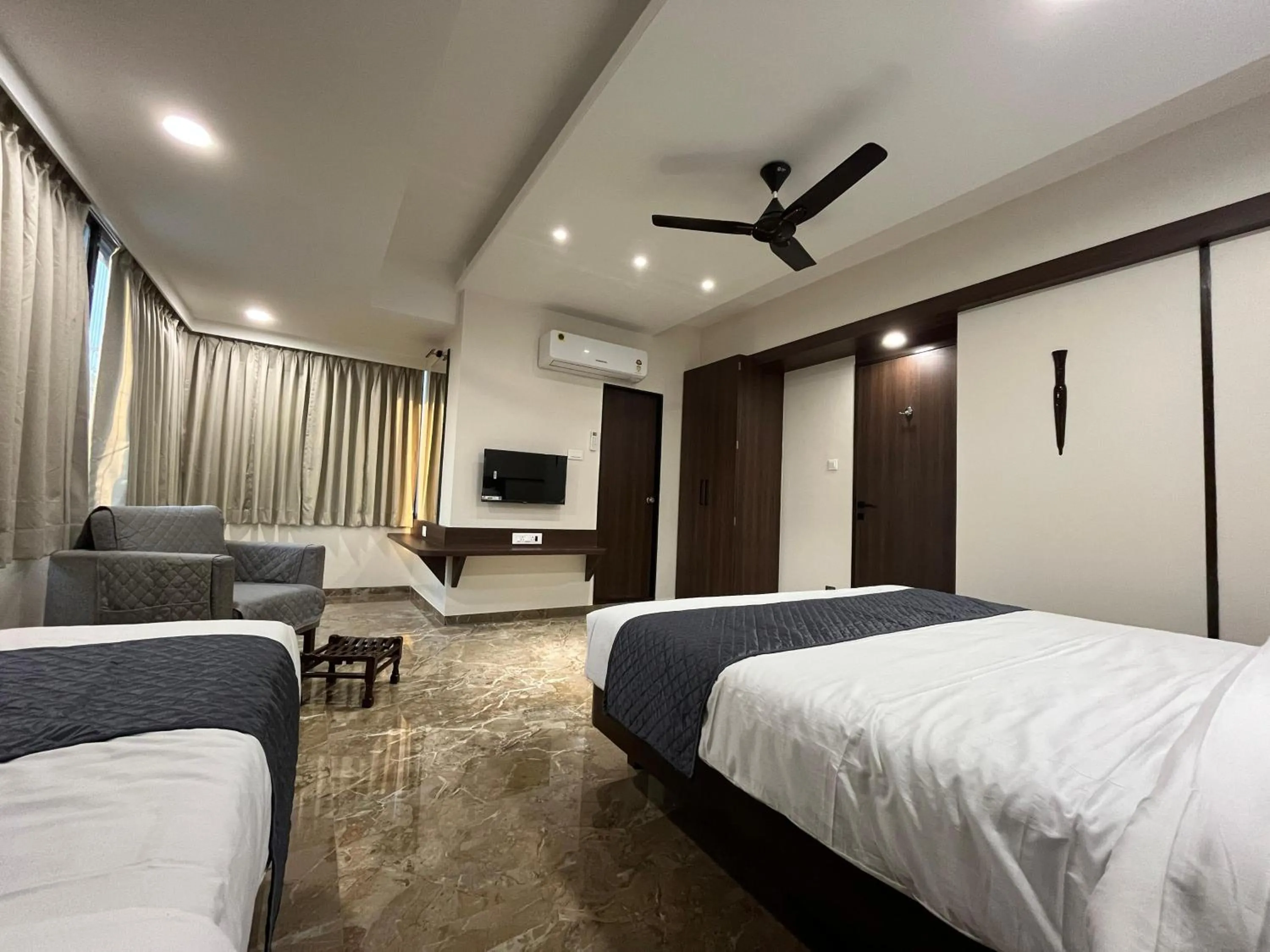 Bed in Kuber Suites