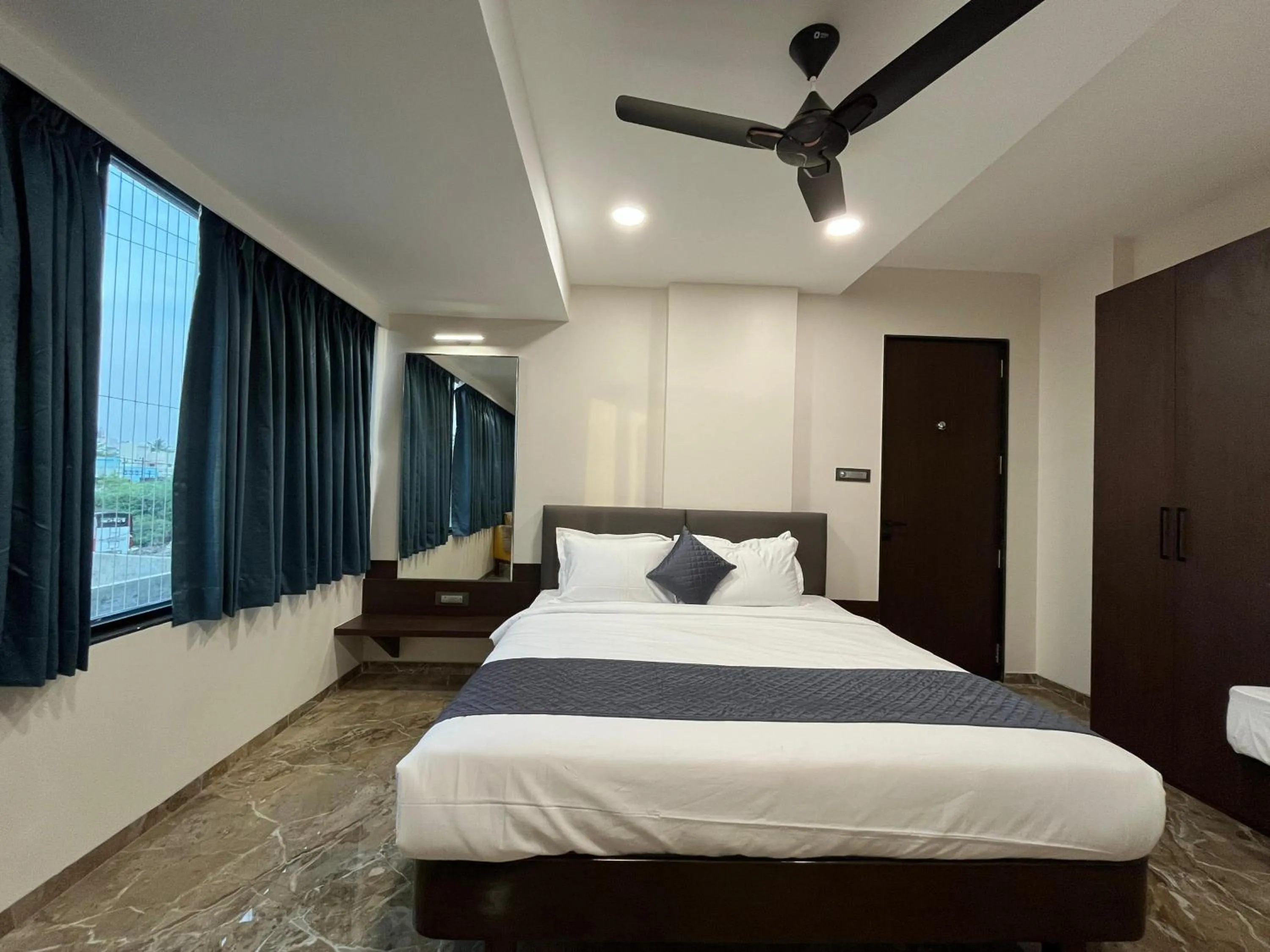 Bed in Kuber Suites