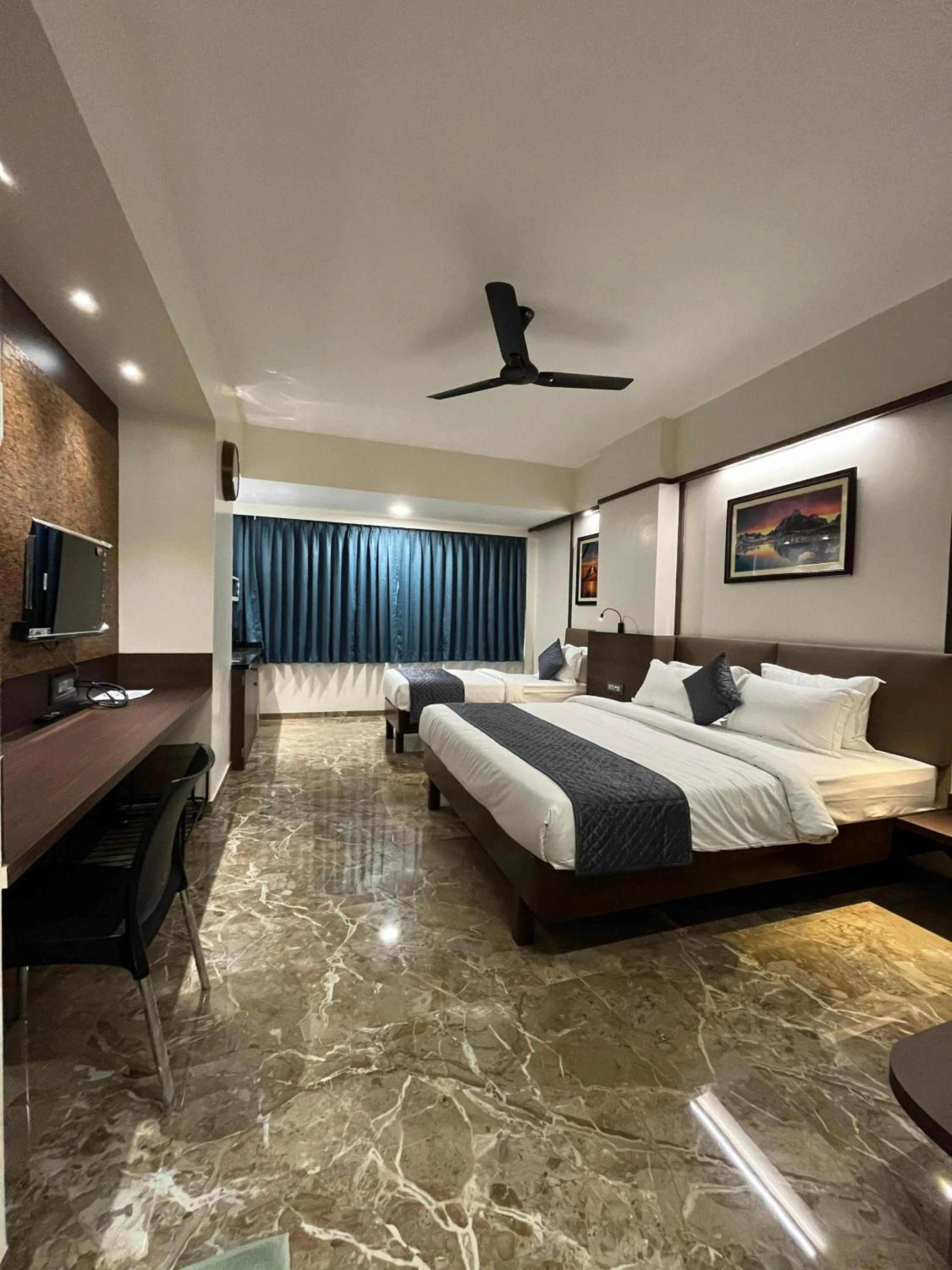 Bed in Kuber Suites